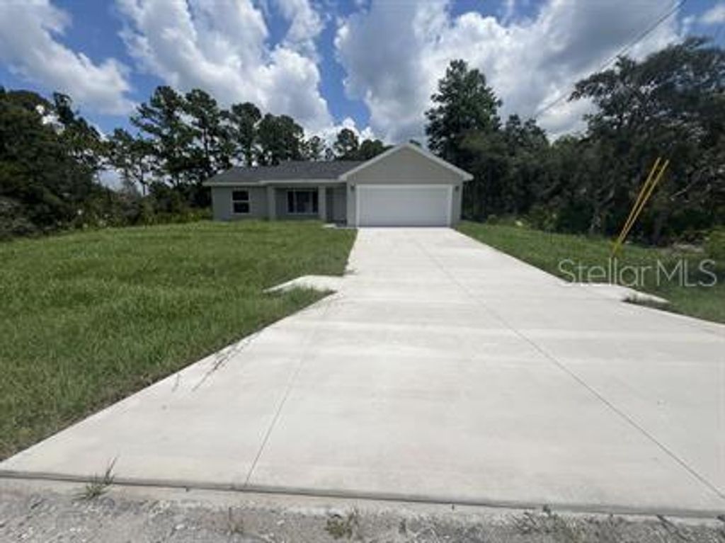 Photo of 69 Malauka Pass, Ocklawaha, FL 32179 (MLS # O6365238)