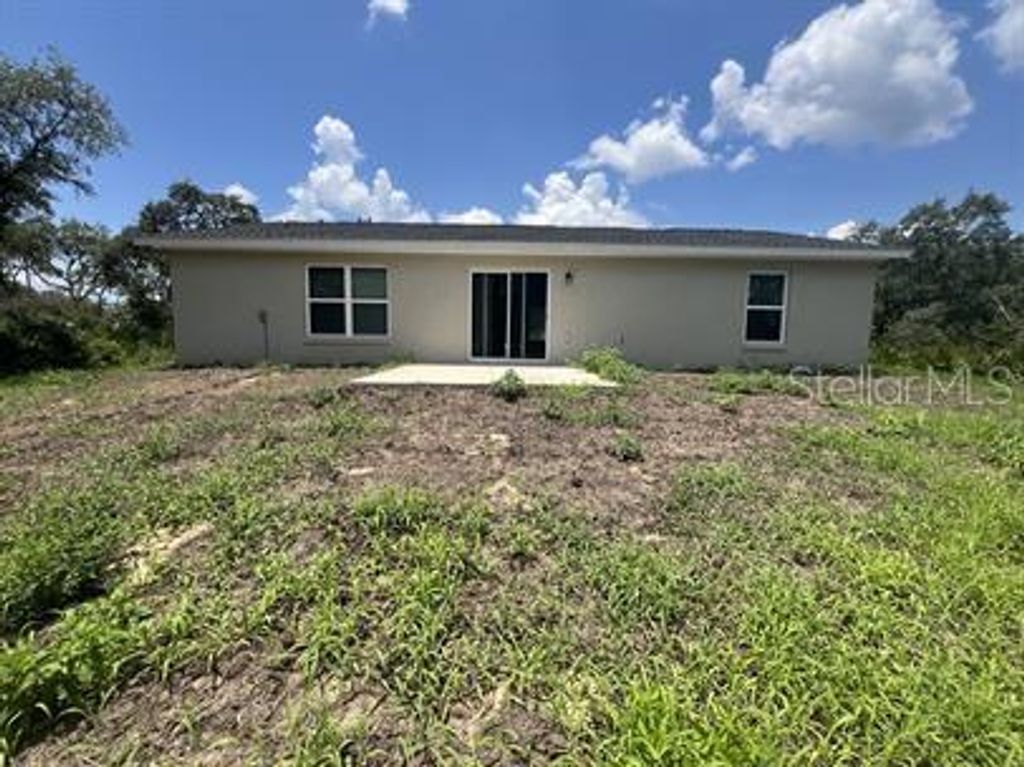 Photo of 69 Malauka Pass, Ocklawaha, FL 32179 (MLS # O6365238)