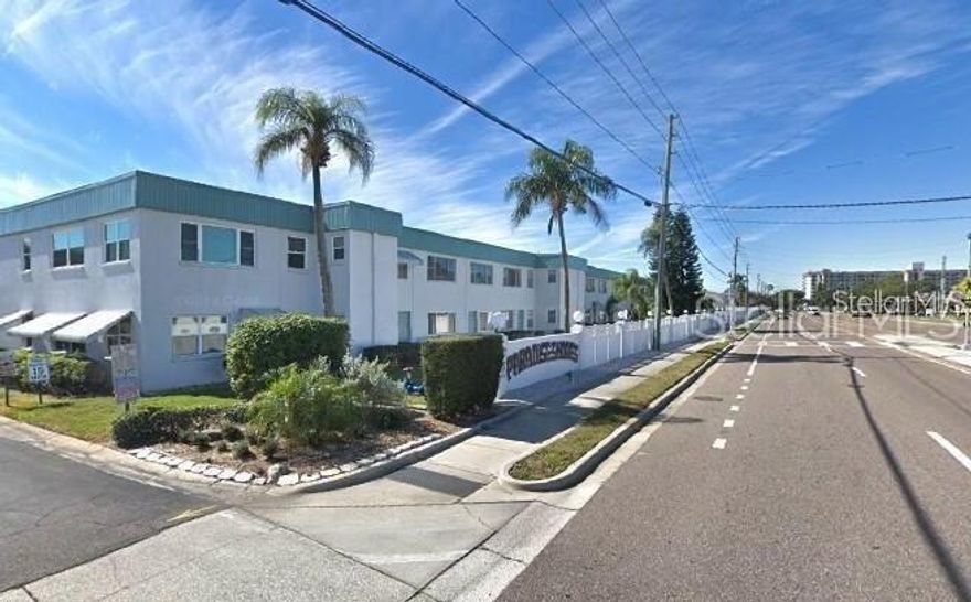 Welcome to your paradise, called "Paradise Shores," in the heart of St. Pete, just minutes from our beautiful beaches, either full-time or as a winter retreat!  What a wonderful place to call home. "RARELY AVAILABLE FIRST FLOOR": This very well-maintained 2-bedroom, 1-bath features a walk-in shower and covered parking space #5 steps from the condo and is move-in ready, turnkey!. As you enter this beautifully appointed 1st-floor condo, you will be greeted by a spacious open floor plan that seamlessly integrates the living, dining, and kitchen areas; there is also a bonus sunroom for additional space for an office or just relaxing with your favorite book and generous closets for plenty of storage. The spacious layout is perfect for entertaining friends and family, and having a covered parking space right outside the back door is now so convenient. This wonderful condo features updated windows, HVAC 2019, tile flooring, an appliance packet, and a walk-in shower in the bathroom for your convenience. Paradise Shores offers the welcoming 55+ condo that not only provides a comfortable living space but also encourages an active and vibrant lifestyle. At Paradise Shores, you can indulge in resort-style living with a heated pool that is open year-round, shuffleboard courts, and bocce ball for friendly conversation under the sun with friends and family. The property offers a grilling station and a community library. The clubhouse is the heart of the community, where you can connect with neighbors and forge lasting friendships. Located just moments from the beach, this condo combines the best of coastal living with the convenience of the nearby VA hospital, Target, Publix, Tyrone Mall, Seminole Outdoor Mall, Madeira Beach, shopping, dining, and cultural attractions, downtown St. Pete, and John's Pass—just too many to list. The monthly HOA fee includes cable TV, Wi-Fi, natural gas for cooking and heating the water (no hot water heaters in the unit; the hot water boilers are covered by the HOA), the building exterior, reserves, grounds maintenance, recreational facilities, the roof, trash, water & sewer. Schedule your private tour today and discover the endless possibilities awaiting you at Paradise Shores. Embrace the lifestyle you deserve. The seller is offering turnkey