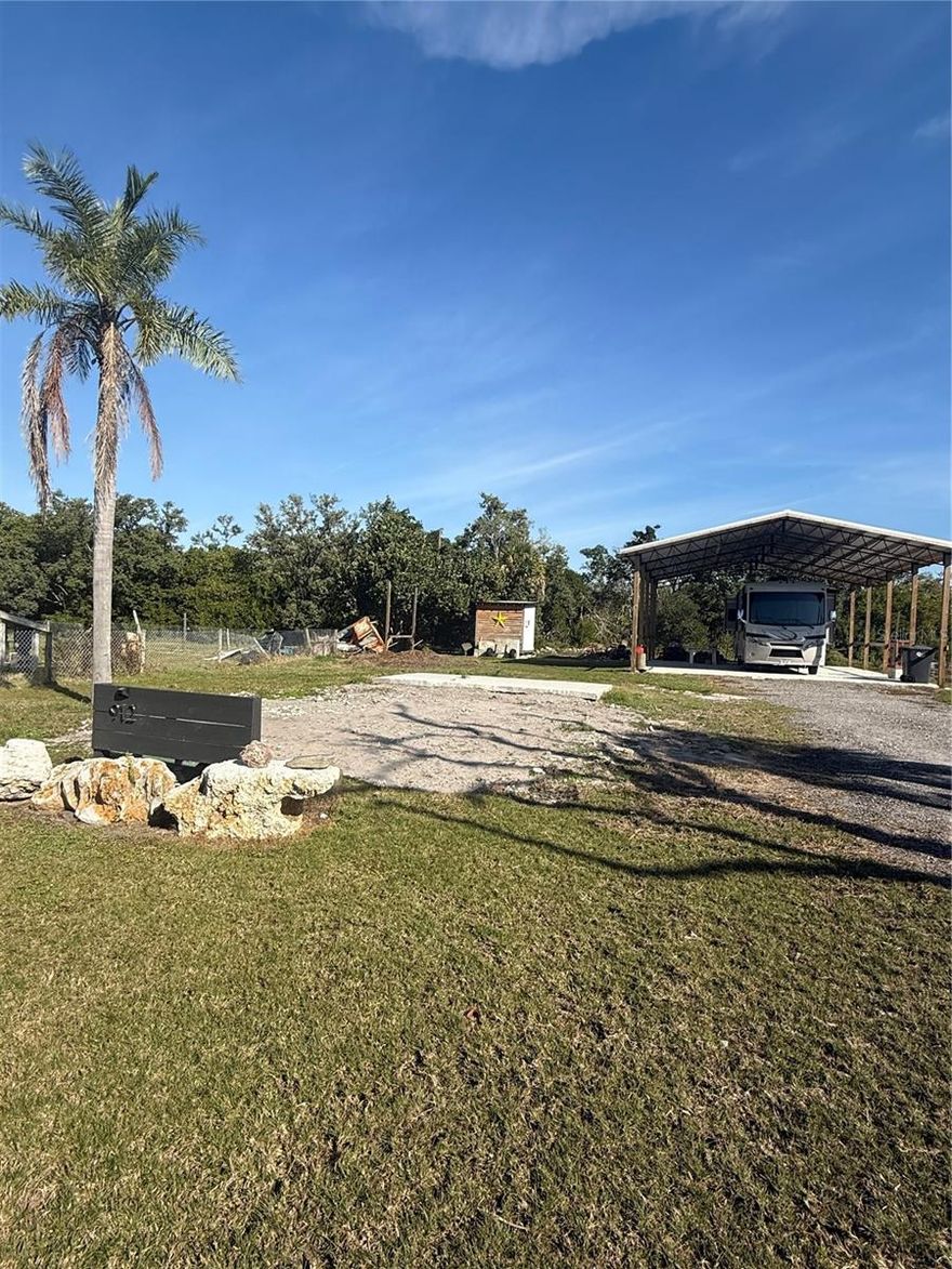 Located just steps from Tampa Bay and a public boat launch, this cleared quarter-acre property at 912 Piney Point Road offers a rare opportunity to create your own slice of Old Florida living. The previous residence has been fully removed, leaving a clean slate ready for new plans.

The property includes a 30’ x 40’ RV structure built on a concrete slab (approximately 6 inches), providing covered space for an RV, boat, or storage while planning future improvements. In addition, there is a small finished shed on site with electrical wiring and air conditioning, suitable for storage, hobby use, or a workshop.

An existing artesian well is located on the property, providing a continuous water source without the need for electrical power, making it well-suited for off-grid use or supplemental water needs.

With no HOA, the property offers flexibility that is increasingly hard to find. Enjoy quick access to fishing, kayaking, and boating in Tampa Bay, along with nearby waterfront dining and convenient connections to Palmetto, Bradenton, and the greater Tampa Bay area.

Whether you are looking to build now or hold and enjoy the property, much of the groundwork is already in place. Buyers are advised to conduct their own due diligence and verify zoning, permitted uses, setbacks, utilities, well condition, flood information, and any future development requirements directly with Manatee County or the appropriate governing authorities.