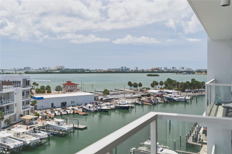 Under contract-accepting backup offers. WOW — this is a stunning south-facing unit in a rare 2021 luxury waterfront building right on the Intracoastal, steps form Downtown Clearwater and the beaches! Step onto your private balcony and enjoy breathtaking ever changing water views with your morning coffee or evening glass of wine. The south-facing orientation floods the home with natural light, making it feel bright and airy all day long. The layout flows beautifully from a seamless, open-concept gourmet kitchen into the expansive living area. The primary suite is a true retreat, featuring a generous walk-in closet and a spa-inspired bathroom with a large walk-in shower and separate controls. Both bedrooms open directly onto the balcony, inviting the serenity of the waterway inside. A spacious 12 × 11 den provides elegant flexibility as a refined home office or third bedroom. The kitchen shines with white wood cabinetry, quartz counters, and a large center island with seating. Resort-style amenities elevate everyday living: a 25-meter saltwater lap pool with Baja shelves, sauna, steam room, state-of-the-art fitness center, putting green, elegant clubroom, full concierge service, and more. This is coastal living at its finest — where every day feels like an exclusive vacation. A rare opportunity not to be missed! The unit comes with 2 parking spaces and storage space.