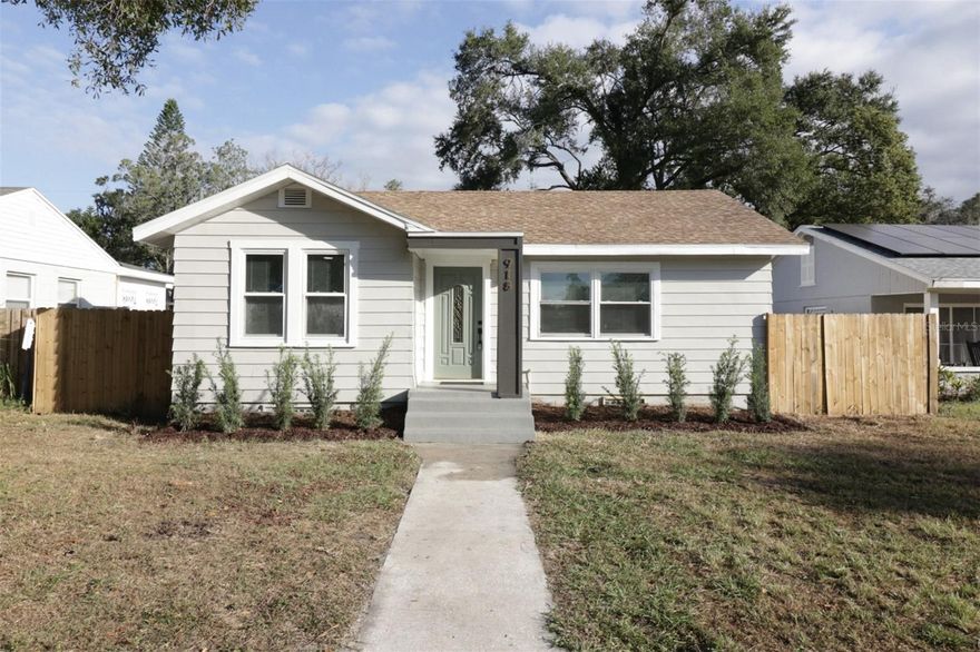 Welcome to your newly renovated home. Newer roof, new A/C, new hurricane impact windows, new plumbing, new electric, new kitchen,  new appliances, new bathrooms, new flooring. Upon entering the home, you'll be greeted by the bright natural light. The floorplan is so versatile. The home can be used as a 4 bedroom home, 2 bed with an inlaw suite or a 3 bedroom with family room. The options are endless. The brand new kitchen is open to the living room which makes for a great entertaining or warm inclusive feel.  The beautifully renovated kitchen offers a modern feel with gorgeous warm toned Slim Shaker cabinets, gold hardware and fixtures, quartz countertops and stainless steel appliances. The rolling island does stay with the home.  Placement of the island allows for many dining options.  The family room makes for a separate entertaining space or can be used as a 4th bedroom, playroom or craft room where you can also access the deck then backyard.  The Primary suite can also double as an inlaw suite.  You have easy access to the fenced backyard from the kitchen, the family room or Primary.  Once in the huge completely fenced backyard, there's so much room for entertaining, playing or additional parking.  The detached shed is perfect for storage, craftroom or whatever your hearts desires. You can access the backyard via the alley on Diana St.  Centrally located in the heart of Tampa, the home is convenient to I275, downtown, Tampa Heights and Seminole Heights.  So many conveniences are just a short distance away.  Take advantage of new restaurants and shops in the area.  This home is a must see and a must have.
