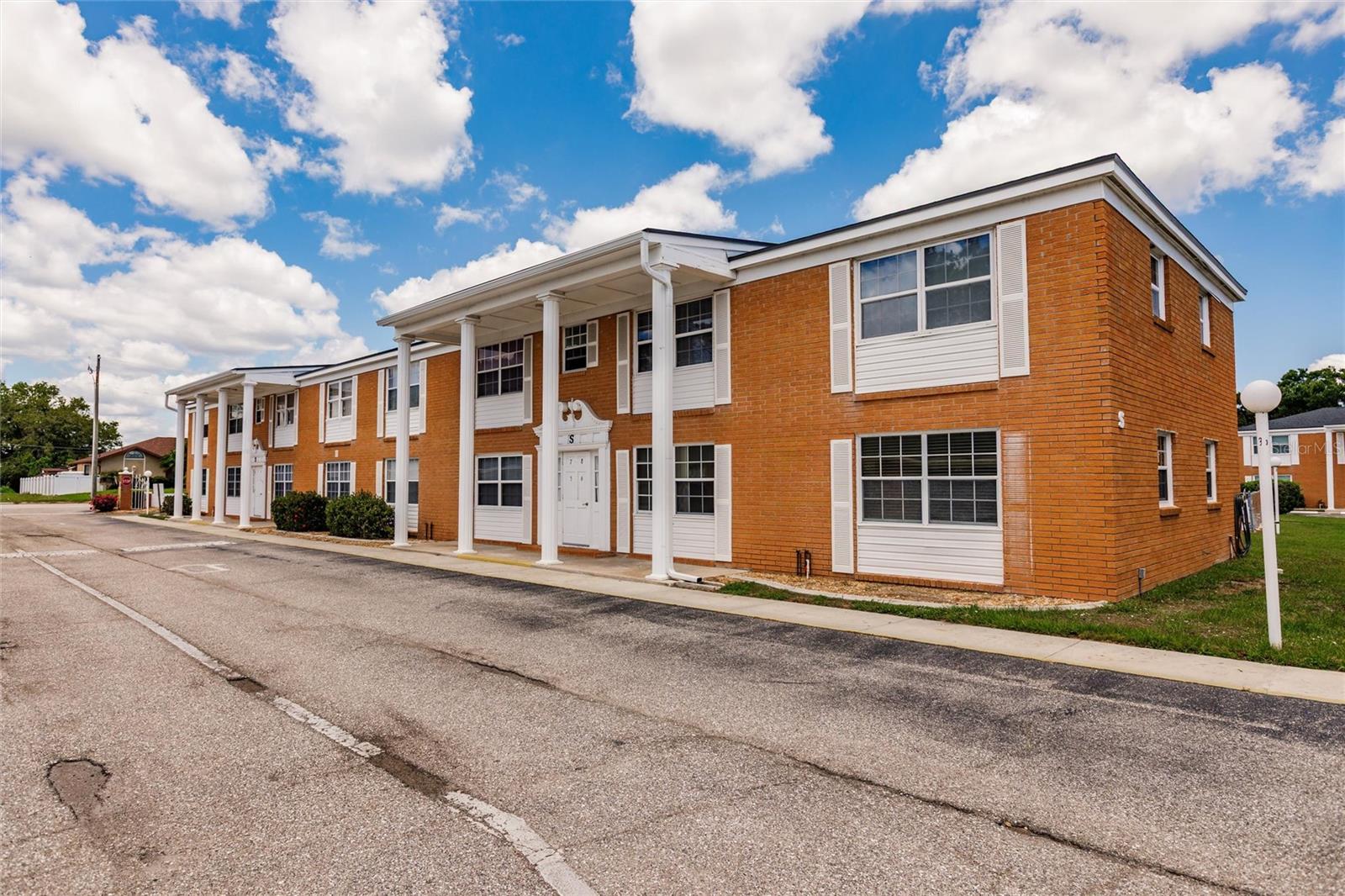 Enjoy the convenience of ground-floor living in one of Port Charlotte’s most desirable 55+ communities—Maria Manor. Ideally situated just off US-41, you're within walking distance to medical facilities, grocery stores, restaurants, and shopping, making every day errands a breeze. Maria Manor offers a welcoming, active lifestyle with amenities that include two heated pools, shuffleboard courts, a clubhouse, pool table, bingo, card games, and a full calendar of seasonal activities. The friendly atmosphere and strong sense of community will make you feel right at home. This spacious 2-bedroom, 2-bath corner unit showcases low-maintenance tile and wood laminate flooring throughout for easy upkeep and modern appeal. The kitchen features a convenient walk-in pantry for added storage. The primary bedroom has a large wall closet and an attached bath with walk-in shower. Guests will love their own bedroom with walk-in closet and access to a full bathroom. The bonus room offers direct access to the pool area and includes an in-unit washer and dryer for your convenience. This versatile space can be used as a home office, reading nook, hobby room, or even a guest sleeping area. The condo also comes with a deeded carport (#5) with storage closet. Monthly fees include water and basic cable TV, adding even more value to this already appealing home. With everything in place, this condo is truly move-in ready. Don’t miss your chance to own a low-maintenance home in a fantastic location. Come see why residents love life at Maria Manor—schedule your showing today!