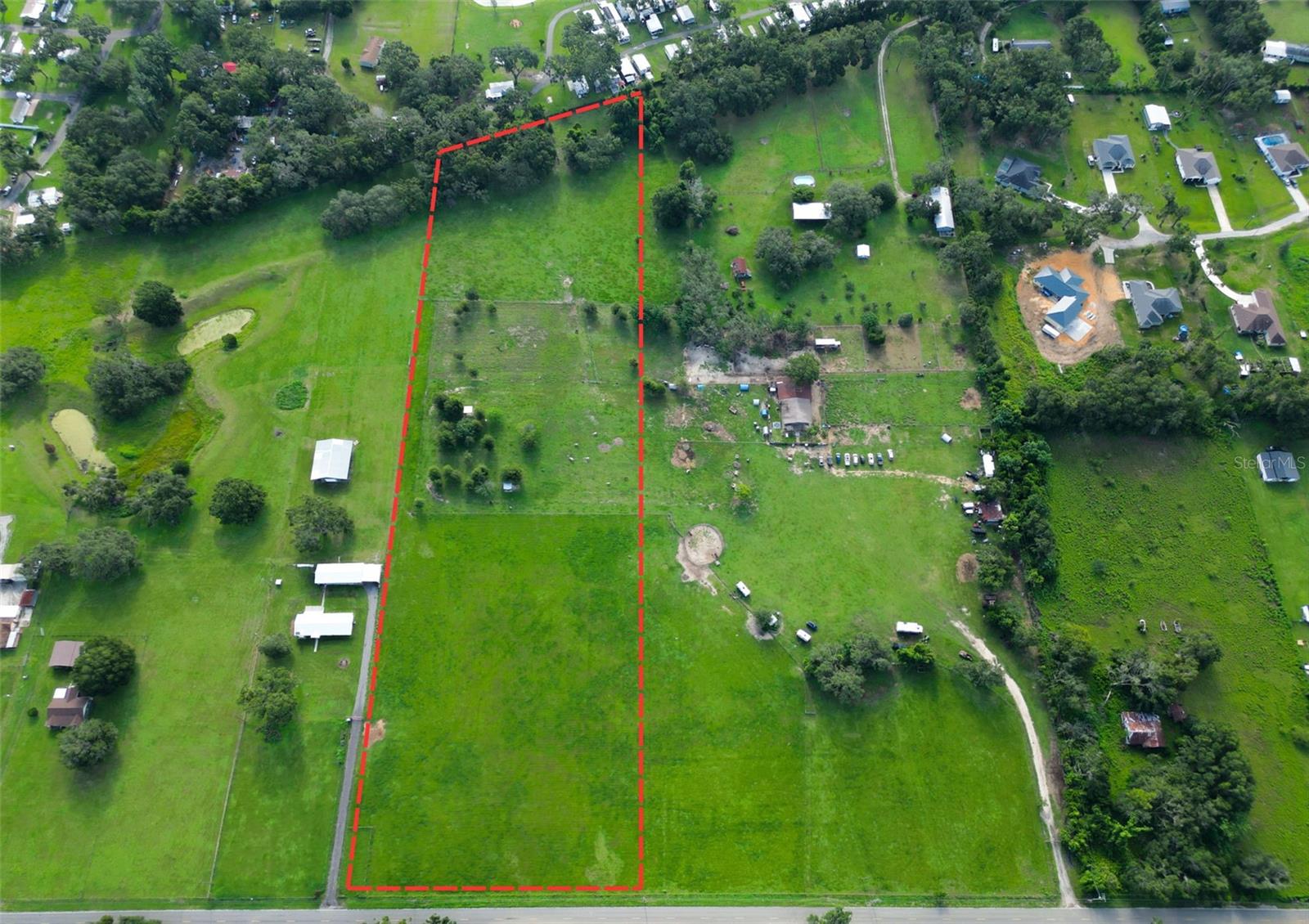 If you’ve been dreaming of wide open space and a chance to create something lasting, this beautiful piece of land in Dade City is calling your name. Whether you want to build a family home, start a hobby farm, raise animals, or just enjoy the peace and quiet of the countryside—this property offers the perfect canvas. There’s plenty of room here for everything you’ve imagined: a custom home, a big barn, multiple fenced pastures, and even that garden you’ve always wanted. From cattle and horses to chickens and goats, there’s space for all your animals to roam. And if you choose to raise cattle, you can take advantage of agricultural tax exemptions—making it a smart investment, too. You’ll love the location: just 10 minutes from Publix and I-75, so you're never far from what you need, but still tucked away enough to enjoy the privacy and serenity of rural living. Dade City is known for its rolling hills, welcoming community, and laid-back charm—it’s truly one of the best-kept secrets in Florida. This isn’t just land—it’s a chance to build a life and a legacy. Come see the potential for yourself.
