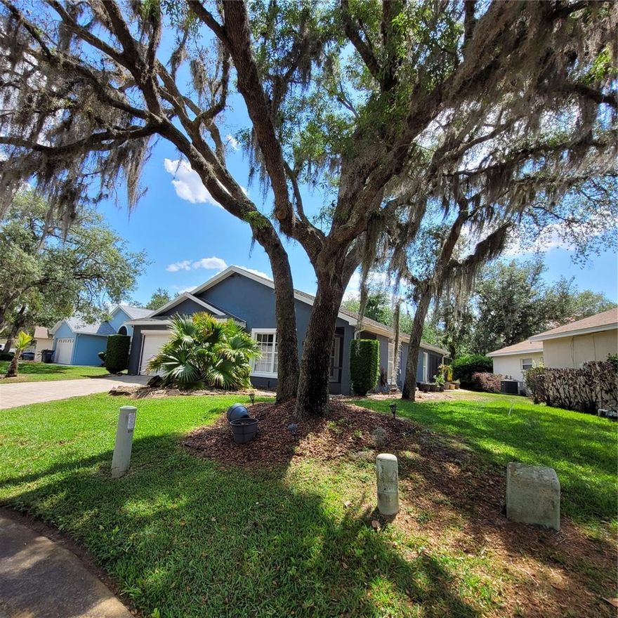 Welcome to this beautifully maintained pool home in the heart of Historic Lake Wales, where charm, character, and convenience come together. Enjoy being just minutes from a vibrant downtown filled with local restaurants, cozy coffee shops, quaint bistros, and even a charming tea room—perfect for relaxed afternoons and lively evenings alike.

This inviting 2-bedroom, 2-bath home offers 1,216 square feet of thoughtfully designed living space. The kitchen features newer appliances and solid surface countertops, creating a functional and stylish space for everyday living and entertaining.

Step outside to your private retreat—a screened pool patio ideal for hosting gatherings or simply unwinding in peace. The pool is heated so you can enjoy the outdoor space year-round.  The backyard is truly special, offering a rare sense of privacy with mature hedges and beautiful oak trees. Whether you're an avid gardener or simply appreciate lush, natural surroundings, this expansive outdoor space is ready to be transformed into your own personal oasis.

Additional highlights include a 2-car garage, a brick paver driveway that enhances curb appeal, and an irrigation system supplied by a well—with the pump replaced just one year ago—helping keep your landscape thriving year-round.

Located within a quiet gated community, this home offers both tranquility and convenience. A perfect blend of comfort, charm, and outdoor living—this is Florida living at its finest.