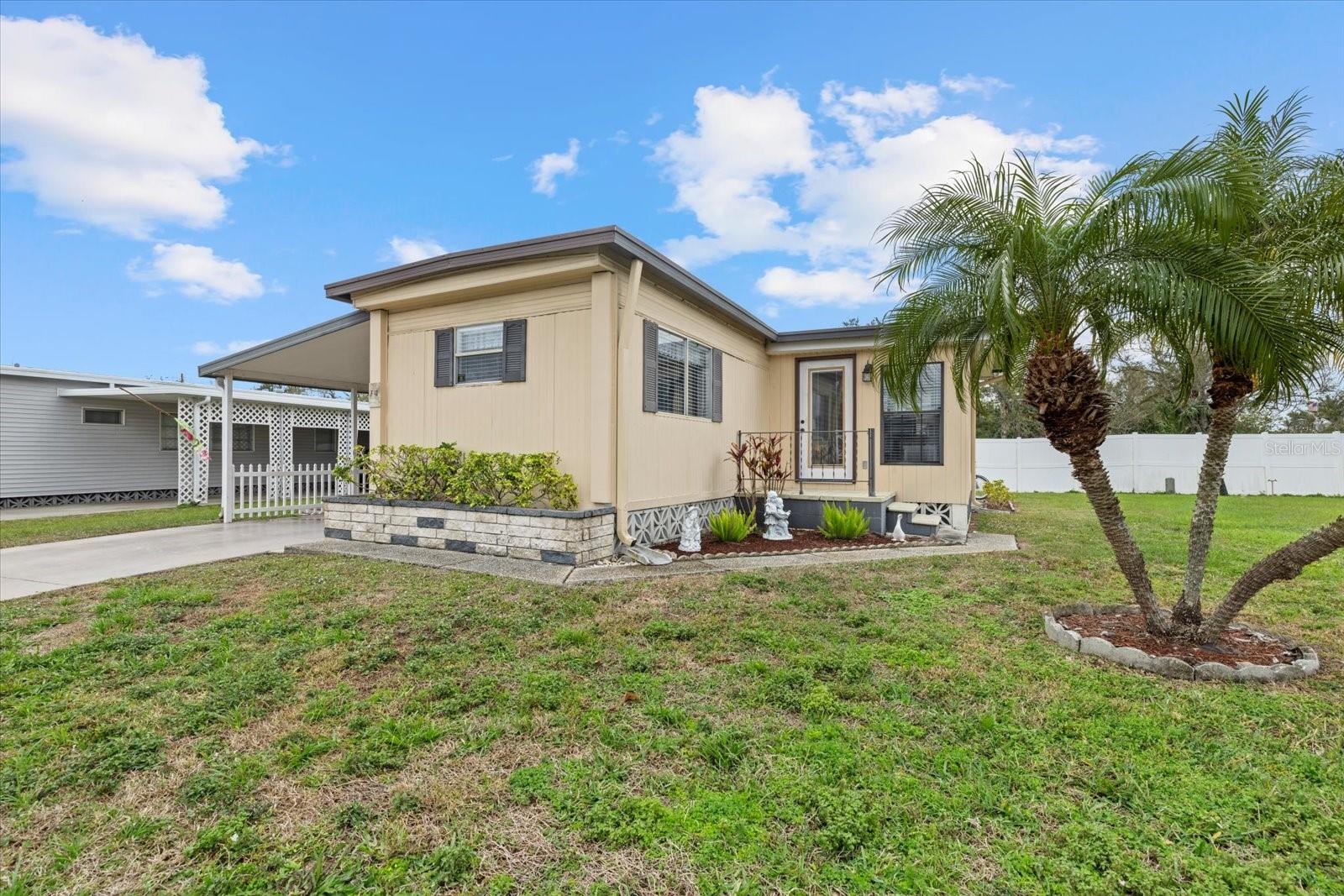 MOTIVATED SELLER! NO WATER DAMAGE FROM DEBBY, HELENE OR MILTON! Larger than it sounds, you MUST see this sturdy 2B/2B that comes FULLY FURNISHED & READY TO MOVE IN!! This cozy home offers a bright and cheery greeting as you first step inside. This is a must see property because so much has been added since last ownership including a completely remodeled kitchen, new bump out with sheetrock, new sub floors and laminate throughout, no carpet! Home has a roof-over too! Tucked away in the ever-so-popular Westwinds Village, an over 55 resident-owned community offering the ideal Florida lifestyle with NO LOT RENT and inclusive monthly fees covering water, sewer, trash pickup, cable, internet, and lawn maintenance. This home boasts an array of community amenities including a heated pool, shuffleboard courts, billiards, library, bowling league, horseshoe and golf leagues, as well as games of Dealer’s Choice Poker, Bridge, Canasta, Pinochle, Line Dancing, and Euchre. Boredom won't be in your vocabulary. There are two entrances to the community, and there is a traffic light available as well for less stress! This home is located close to the office and clubhouse and has RV/Boat Storage space with special pricing for their Residents. Book your showing today and don't delay, this won't last long!