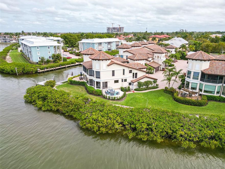 This exquisite home offers unparalleled views of the stunning Naples Bay from every window. The expansive water views invite you to unwind and savor the beauty that surrounds you. With three bedrooms each with their own private bath, and an open floor plan that effortlessly connects the interior space with the outdoor scenery. The home has been completely renovated top to bottom with an open marble staircase, built ins and upgrades too numerous to mention. An outdoor deck designed to maximize the stunning water views extends gracefully from the side of the home. It also comes with your own private dock. Nestled in an enclave of 8 exclusive townhomes with a centerpiece just renovated pool and new Tiki Hut combined with the architecture of these townhomes provides a seamless blend of coastal luxury. A must see. Call for an appointment.