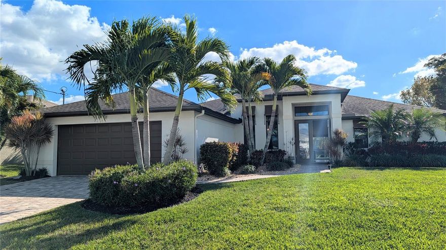 Welcome to this beautifully maintained freshwater waterfront home located in a quiet and established neighborhood of Southwest Cape Coral. Built in 2016 and thoughtfully cared for by its owner, this four-bedroom, three-bath residence offers a perfect balance of comfort, functionality, and Florida waterfront living.

Situated on a spacious .23-acre lot with southern rear exposure, this home features 2,137 square feet of living space and a desirable split-bedroom floor plan designed for both everyday living and entertaining. From the moment you arrive, the home’s curb appeal is evident with mature landscaping, a decorative driveway, and a clean stucco exterior that reflects pride of ownership throughout.

Inside, the great room layout welcomes you with volume and tray ceilings, abundant natural light, and tranquil water views that immediately draw your attention to the canal beyond. The living spaces flow seamlessly into the dining and kitchen areas, creating an open and inviting atmosphere. Flooring throughout the home includes a combination of tile, laminate, and carpet, offering durability and comfort in all the right places.

The kitchen is well-appointed with ample cabinetry, a breakfast bar, and quality appliances including a range, microwave, dishwasher, and refrigerator/freezer. Whether preparing daily meals or hosting guests, this space is both practical and welcoming.

The primary suite, located on the ground level for convenience, serves as a private retreat. The en-suite bathroom features dual sinks, a jetted soaking tub, and a separate walk-in shower, providing a spa-like experience at home. Additional bedrooms are generously sized, ideal for guests, family members, or flexible use such as a home office or hobby room.

Step outside to enjoy true Florida waterfront living. The below-ground concrete pool overlooks a peaceful freshwater canal with an existing seawall and private composite dock, perfect for kayaking, paddleboarding, fishing, or simply enjoying the calming water views. The southern exposure allows for abundant sunlight throughout the day, making the outdoor space ideal for relaxation or entertaining.

This home also offers valuable peace of mind with impact-resistant windows and doors, along with manual shutters for added storm protection. Additional features include a two-car attached garage, automatic irrigation system, laundry room with tub, and assessments paid for water, sewer, and irrigation.

Located in a non-gated community with no HOA fees, this property is close to shopping, dining, schools, and major roadways, while still offering a quiet residential setting. The owner has maintained the home meticulously, making it truly move-in ready for the next homeowner.

Whether you’re seeking a full-time residence, a seasonal retreat, or a waterfront lifestyle without the complexity of Gulf access, 1426 SW 12th Terrace offers an exceptional opportunity to own a quality home on freshwater in Southwest Cape Coral.