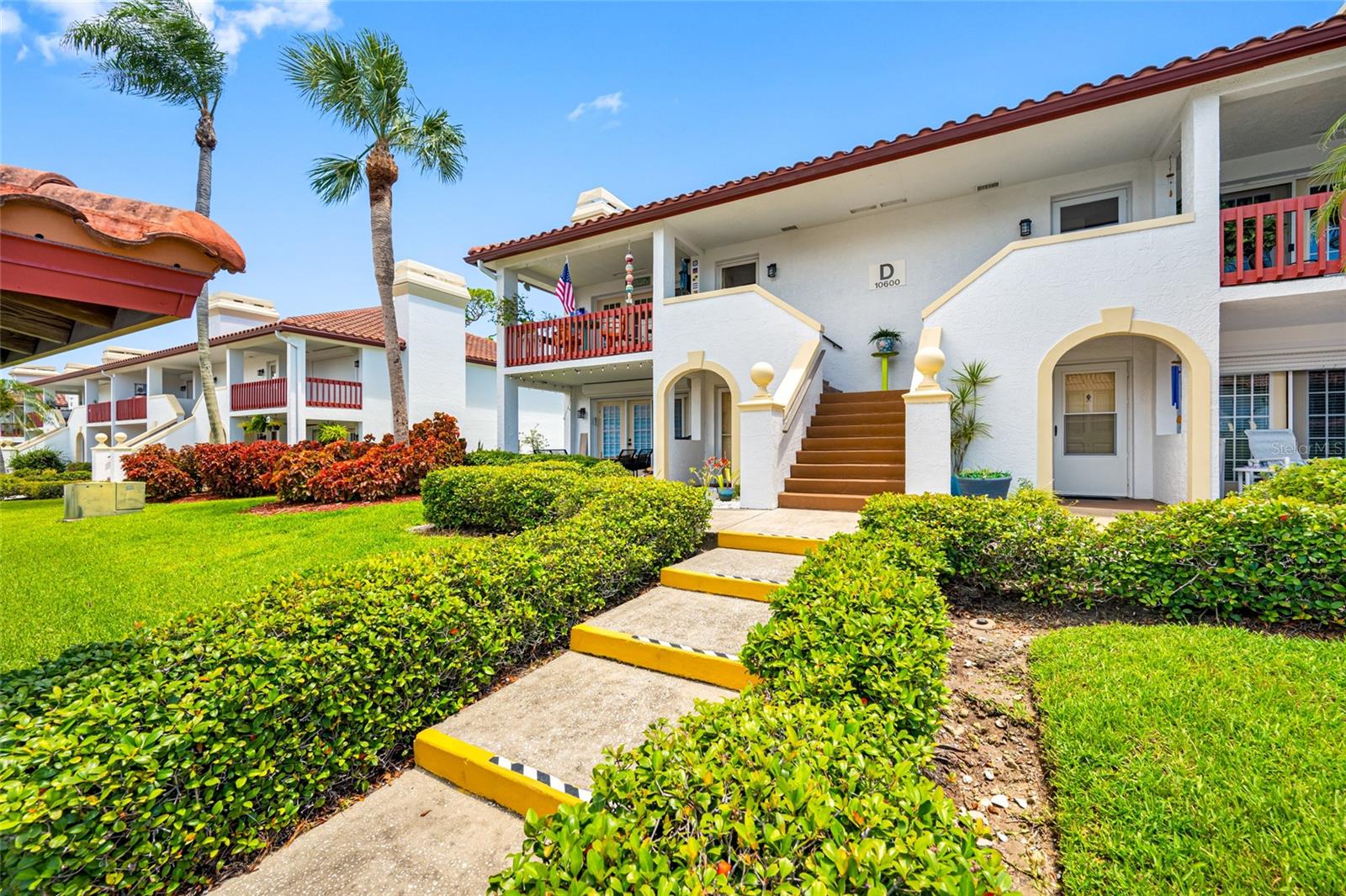 The Village on Lake Seminole is one of the best kept secrets in Seminole. It is tucked away between Seminole Blvd and Lake Seminole. This charming community is only 48 units. A lovely Mediterranean block buildings with red tile roofs. The community has access to Lake Seminole but it is not in a flood zone. This home has been completely remodeled with a gorgeous light bright and stylish kitchen. With tons of counter space, cabinets and upgrades. Granite counter tops, stylish backsplash, SS GE appliances, 2 lazy Susans, cabinets with pull out shelves, plenty of can lighting, cabinets are all wood construction, the microwave is inside a cabinet, lighting under cabinets AND above (on separate switches) plus the ceiling was raised to match the great room. Open floor plan with living room, dining room, dry bar and kitchen all one large space. The Master Bedroom is big enough for a king sized bed, has a HUGE walk in closet with built in storage, and a STUNNING ensuite bath with walk in shower and frameless shower doors. Second bedroom also has a walk in closet that is so big the owner uses it as his home office. Other special features are: Impact windows in the bedrooms 2023, A/C was replaced in 2019, TV mounted in living room stays, ceiling fans in the living room and bedrooms, a Full sized laundry room that includes a washer and dryer and French doors out to the balcony that has a view of the Lake. Exterior storage room shared with downstairs neighbor and additional storage above the unit (pull down stairs in the master closet). This community features a dock/fishing pier on Lake Seminole and a community pool. Monthly fees include water, sewer, trash, insurance, exterior maintence, building painting, roof replacement, cable and internet. Short drive to the beaches, shopping and many restaurants.