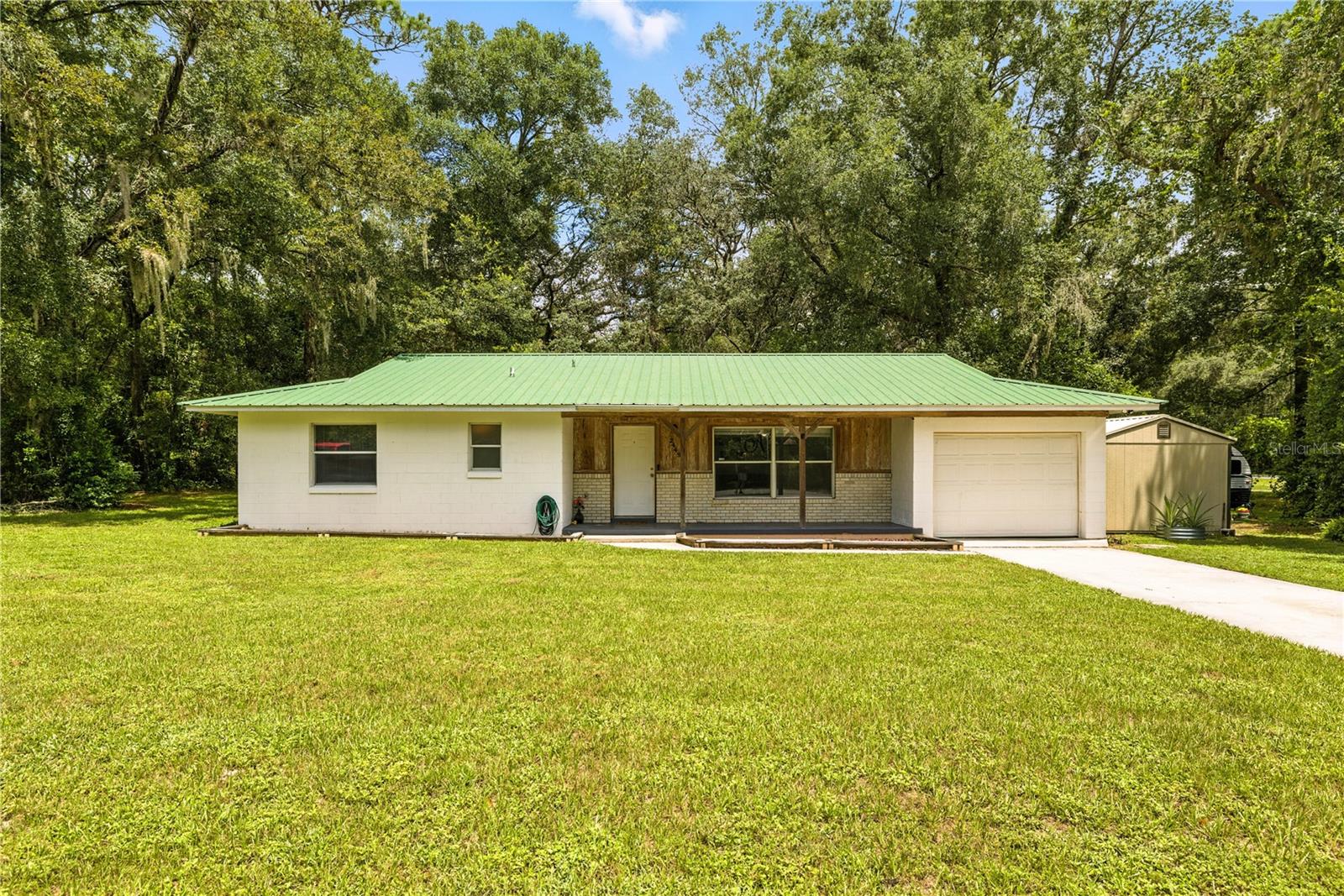 Welcome to 2449 NE 40th St in Ocala! This beautifully updated 3-bedroom, 2-bathroom home offers over 1,400 sq. ft. of living space on more than half an acre. Highlights include a durable metal roof, newly remodeled kitchen with modern finishes and newer stainless steel appliances, new luxury vinyl flooring, and fiber optic internet for lightning-fast connectivity. The split-bedroom layout offers privacy, while the open living spaces are perfect for gatherings. Outside, you’ll find a garage for parking or projects and a storage shed for all your tools, toys, or hobbies. The spacious yard provides room for gardening, play, or even a future pool. Located just steps from the bus stop and minutes from shopping, dining, medical facilities, and parks — with quick access to Downtown Ocala, Silver Springs State Park, Hwy 301, and I-75. YOU CAN GET UP TO A 1% LENDER CREDIT UPON SUCCESSFUL CLOSING WHEN USING PREFERRED LENDER BRITTANY THOMPSON WITH SUCCESS MORTGAGE PARTNERS INC. This move-in-ready home combines style, space, and a great location — don’t miss it!