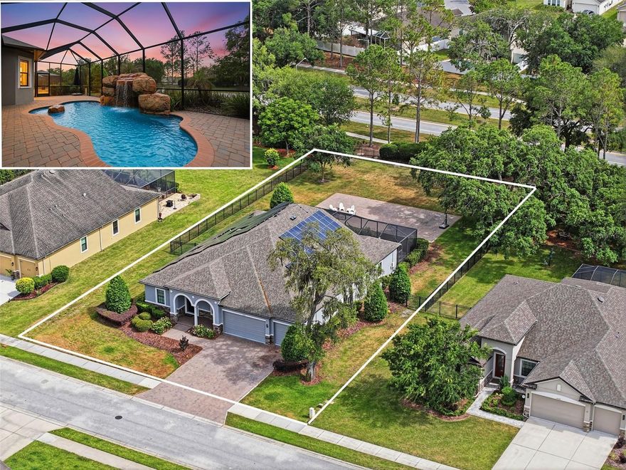 One or more photo(s) has been virtually staged. STUNNING GROTTO POOL HOME - FORMER MODEL HOME in the gated Carlisle section of Avalon!! This one has it all!! Move-In Ready! 5 Bedrooms + Office + 5 full bathrooms + 3-car garage + fireplace + incredible outdoor living space with private GROTTO WATERFALL pool with swim-up seating + large covered lanai + large brick paver pool deck with screen enclosure + completely fenced backyard + large brick paver outdoor area for outdoor seating/basketball area...the ultimate home for entertaining family and friends!! A must-see!! SOLAR PANELS (2020) -- THESE ARE PAID OFF and under warranty AND act as a generator!! No electric bill except the minimum monthly meter charge or $30. This is a LARGE IMPRESSIVE HOME with 3,802 living space; 4,866 total sq footage! Two BRAND NEW AC UNITS with UV Lights ($37,000) with warranty!! Roof 2017. NO CDD Fee!! Low HOA fee of only $343.11 per quarter total. Community pool + clubhouse + fitness center!!

Brick paver driveway with 3-car width for extra parking! OPEN FLOOR PLAN with large glass sliders and windows make this home feel light, bright, and spacious!!  The new splash park at Anderson Snow Park is minutes away! Just minutes from the Suncoast parkway for quick and easy access to Tampa!! GREAT LOCATION!! 

STUNNING DREAM KITCHEN with extra large breakfast bar with curved radius so everyone can see each other!! Real wood cabinets and impressive granite countertops, cooktop, stainless steel appliances...everything is just stunning!! Formal dining room + breakfast nook!! Upstairs bonus room as full bathroom...can be a bedroom with ensuite bathroom, or theater room/man cave, or extra living room for the family!! The office downstairs has an ensuite bathroom with is also a pool bathroom; this can also be used as a bedroom if you need a 6th bedroom!! 

The downstairs master bedroom has a large ensuite bathroom with granite countertops, dual sinks, real wood cabinets, large walk-in ceramic tile shower, private toilet closet, and large walk-in closet with built-in closet organizers!! All 4 additional bathrooms have the matching upgraded granite countertops and finishes.

This was the model home, so it has ALL the extras and upgrades from tray ceilings, gorgeous wood plank flooring, crown molding, wall accents, stone fireplace, designer lighting, extra cabinets in the laundry room...everything...it has all the extras!! 

Close to everything!! Shoppes, restaurants, hospitals, schools...everything!! 20 minutes to kayaking, paddle-boarding, and swimming with the manatees in the clear Weeki Wachee River or enjoying a day at Buccaneer Bay Water Park!! 25 minutes to the sunsets at Pine Island, boating and fishing!! 35 minutes to Tampa International Airport and to all the fun that Tampa Bay has to offer!! 1 hour + to TOP US BEACHES!! 1.5 hours to Disney World and Universal Studios and all the theme parks!!