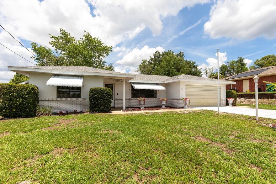 One or more photo(s) has been virtually staged. Homes with this much potential at this price point in Deltona do not come up often, especially with no HOA, a large .28 acre homesite, and the peace of a wooded backdrop. Welcome to 742 Armadillo Drive, a solid concrete block 2 bedroom, 2 bath home offering the perfect opportunity for buyers looking to personalize a well built property while enjoying major updates already completed. Tucked away on an oversized lot with an extra deep driveway, this home offers added flexibility for additional parking, guests, recreational vehicles, boats, or everyday convenience WITHOUT restrictive HOA rules or monthly dues
Inside, you will find a functional layout ready for your vision, along with brand new luxury vinyl plank flooring in both bathrooms for a fresh, updated feel. Major improvements including a 2023 roof and a new electrical panel provide peace of mind and help reduce some of the larger expenses buyers often worry about after closing. Hurricane shutters and aluminum awnings provide additional storm protection while also helping reduce direct sun exposure, keeping the home cooler and adding practical energy saving benefits during Florida’s warmer months.
The spacious screened enclosed patio creates the perfect place to enjoy Florida living year round while overlooking a lush tree lined backdrop that adds privacy and a peaceful natural setting. Whether relaxing with your morning coffee or entertaining friends and family, this outdoor space extends the living area beautifully.
The garage adds even more practical value with a utility sink, built in workbench area, and a transfer switch already installed for a future generator setup, a feature buyers increasingly appreciate for convenience and storm preparedness.
Conveniently located near I-4, shopping, dining, medical facilities, and everyday conveniences, this property offers an ideal balance of accessibility and quiet residential living. Whether you are a first time buyer, downsizing, investor, or someone searching for a sturdy home with room to add your own personal style, this property stands out as one of the best values currently available in the area.
