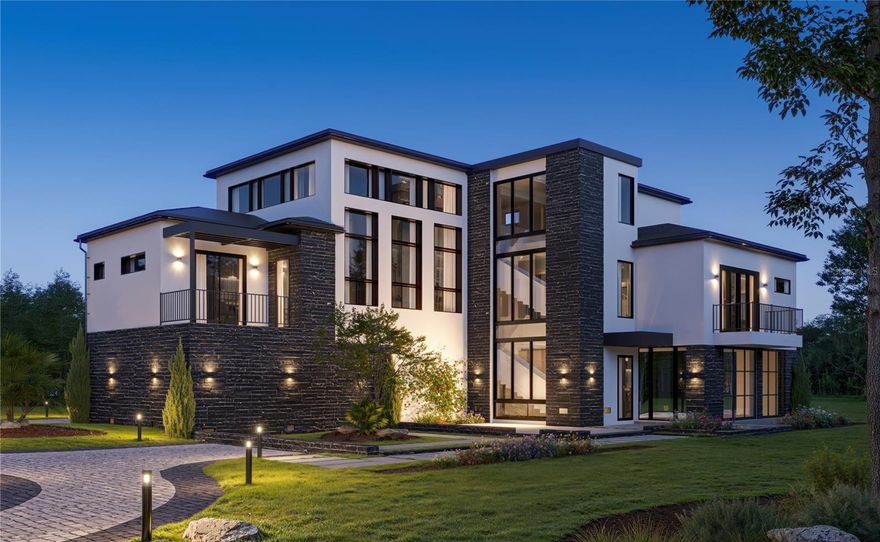 One or more photo(s) has been virtually staged. Under Construction. Welcome to Marsh Pointe, Tampa’s newest gated enclave of modern luxury living. This brand-new contemporary coastal-modern residence blends architectural sophistication & ICF exterior construction; which is rarely offered in this market, for energy efficiency, moisture resistance & storm resilience. This home offers clean lines, soaring ceilings, and an open-concept design that floods the home with natural light. Upon arrival, you will note a private courtyard garden & reflection pool. Take in the breathtaking large curtain wall window with architectural stair feature upon entry & you’ll further experience the openness of this home. 
The gourmet kitchen serves as the heart of the home, featuring premium cabinetry, quartz surfaces, an oversized island, top-tier appliances & a separate scullery kitchen ideal for both entertaining & daily living. The main living area features 21’ ceiling which transitions seamlessly from kitchen to living room, ideal for entertaining around the fireplace. 
The luxurious primary suite is a serene retreat with a generous walk-in closet & a spa-inspired bath, dual vanities, oversized shower and built-in coffee bar for a true private retreat feel. Additional bedrooms provide flexibility for guests including a private guest suite. Working from home takes on a new meaning in your dedicated home office/flex room.
Ascend to the upper levels of this home via the elevator servicing all floors & take in the expansive 2nd level view of the living room down below where another fireplace awaits. Adjacent to this opening you will find two more generous bedrooms & media room/lounge.
The main level of the home opens to the enclosed & dedicated wellness level including a performance studio gym, recovery/spa pavilion & an enclosed pool with spa-style rinse shower. Easily transition to your outdoor space, where a covered lanai overlooks a private backyard with enclosed pool. Tranquility also awaits outside your door with a reflection pond & courtyard garden. All the elements come together to create a home that is a masterpiece of art; thoughtfully designed luxury lifestyle residence focused on privacy, wellness and long-term quality.
Additional features of this home are the impact-rated windows & doors, tankless water heaters, water softener system, plus smart home integration throughout. Located in the private gated community of Marsh Pointe, residents enjoy quiet streets, natural surroundings, and convenient access to Tampa’s top schools, shopping, dining, and major commuter routes. This is contemporary Florida living at its finest.
*Don't delay; now is the time to request your personal finishes.*