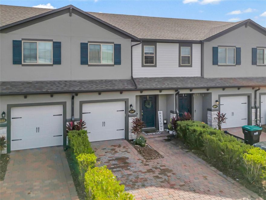 Back on the Market - Experience the balance of modern living, convenience, and community of 1247 Flowing Tide Drive in the Towns at Avalon Ridge community. This townhome, built in 2019, offers 1,451 square feet of spacious living area, including three bedrooms, two and a half bathrooms, a loft area, a screened patio, and a one-car garage. 

Upon entering, you'll be greeted by a sunlit open floor plan that flows seamlessly from the foyer to the living and dining areas, making it an ideal space for entertaining. The gourmet kitchen is a chef's dream, equipped with state-of-the-art stainless steel appliances, granite countertops, and a spacious island perfect for gatherings. Open the sliding glass doors to reveal a private screened patio where you can relax in the Florida sun or enjoy pest-free outdoor dining.

Back inside, the second floor features a luxurious primary suite with a spacious walk-in closet and an ensuite bathroom with dual sinks and a contemporary shower. You'll also find two additional well-appointed bedrooms upstairs that share a full bathroom with a relaxing tub. The laundry room is conveniently located on the same level for added ease. The second floor also offers a small loft area that can be used as a quiet reading nook, study area, or a small play area.

Other notable features of this home include a one-car garage, energy-efficient windows, cutting-edge smart thermostat, a prime location with easy access to major highways 408, 528, and 417, Avalon Park, Waterford Lakes, UCF, and a variety of shopping, dining, and entertainment options.

The Towns at Avalon Ridge community offers amenities that prioritize your lifestyle, including a refreshing pool, ample guest parking, a playground, and a dog park for leisurely walks with your furry friend. Don't miss the opportunity to experience the best of Orlando living in this vibrant neighborhood. Schedule your showing today and envision your future at 1247 Flowing Tide Drive!