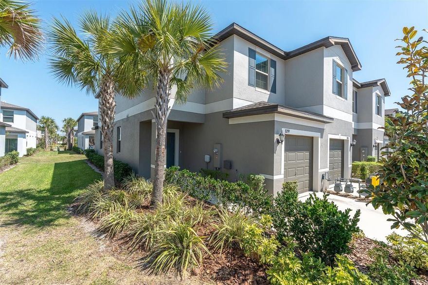 One or more photo(s) has been virtually staged. BUILT in 2023-Enjoy added privacy, extra windows, and natural light in this END-UNIT townhome in the highly desirable Mitchell Ranch 54 West / Trinity area of New Port Richey. With 2 bedrooms, 2.5 baths, a loft, 1-car garage, and a screened-in patio this home offers the perfect blend of modern finishes, natural light, flexible living space, with low-maintenance ownership. This end-unit location allows extra windows and abundant natural light that gives the home a brighter, more open feel throughout. From the moment you enter, the foyer opens into a spacious main living area that flows seamlessly through the family room, dining space, and kitchen. Currently zoned for Seven Springs Middle and J.W. Mitchell High School. NOT located in a flood zone! The kitchen features a gas range, shaker-style cabinetry, a layout that opens directly to the living space, and a screened-in lanai area making it ideal for entertaining. Tile flooring throughout the downstairs with a half bath on the main floor offers added convenience for guests. Upstairs, both bedrooms are privately tucked away along with a laundry room with extra cabinet storage, and a loft area that works perfectly for a desk, home office, or study area. The stairs and bedrooms are finished with carpet, while the bathrooms feature tile flooring. Sliding glass doors lead to a screened-in patio, giving you a comfortable outdoor space along with access to a shared backyard green space. This home offers the added benefit of newer energy-efficient construction , meaning buyers can enjoy the confidence that comes with a newer roof, newer AC, newer tankless heater, and hurricane shutters. This property is an excellent choice for a primary residence, second home, or an investment opportunity, all in a highly convenient location near shopping, restaurants, Trinity medical facilities, parks, and major commuting routes. Community amenities include a pool, playground, and walking areas.