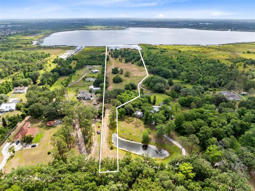 Experience the rare opportunity to own 5.82 pristine acres with over 373 feet of private lakefront on the serene waters of Fells Cove, part of the coveted East Lake Toho chain of lakes. This exceptional property offers a tranquil retreat with no HOA restrictions, allowing you to design and build your dream estate with the builder of your choice. A ready-to-build dirt pad is already in place, making your vision one step closer to reality. Nestled amidst abundant wildlife and natural beauty, yet just minutes from Lake Nona, Orlando International Airport, St. Cloud, and the VA Hospital, this one-of-a-kind offering perfectly balances seclusion and convenience. Whether you envision a luxurious lakefront residence or a private family compound, this property is a canvas for extraordinary living.