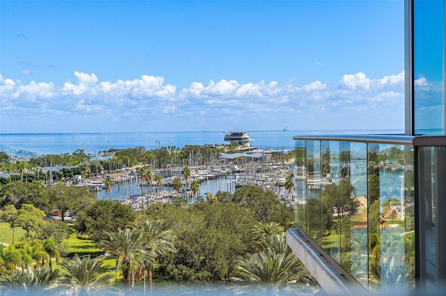 BEAUTIFUL and SPACIOUS WATER VIEW CORNER UNIT AT ONE ST. PETERSBURG! Step into a world of elegance as you enter this light-filled 3-bedroom, 3.5-bath + den corner residence. Every detail has been carefully curated to elevate your living experience. The 24" x 24" porcelain tile flooring flows seamlessly throughout, setting the stage for a space that exudes sophistication. The kitchen is the epitome of culinary excellence, featuring European cabinetry, top-of-the-line stainless steel appliances, marble slab backsplash, and hand-crafted Italian blown glass light fixtures that hang gracefully over the kitchen island. As you gaze out from the floor-to-ceiling glass windows, prepare to be mesmerized by unobstructed water and city views that envelop the north corner with spa like garden and pool views on back terrace. Three private terraces offer a retreat to soak in the breathtaking surroundings which include stunning sunrise views over the water to the east and sparkling sunset views over the city to the west. Inside, convenient electric blinds allow you to easily control the amount of light throughout the day with blackout shades in the owner and guest suites providing the ultimate in privacy and relaxation. Custom built-ins in the closets provide ample space to keep all your finest items organized and tucked away. With two extra wide protected parking spaces and a climate-controlled storage unit conveniently located on the 5th floor, your convenience and peace of mind are assured. This luxurious lifestyle extends beyond your residence. ONE St. Petersburg offers a wealth of amenities to elevate your everyday living. Only one flight down, walk to a 5,000 square foot free-standing fitness facility, a 75' heated lap pool with a soothing waterfall backdrop, 12 private cabanas, 2 inviting fire pits, and an outdoor kitchen with additional grills make for the ultimate outdoor oasis. Indulge in social gatherings in the formal social room with panoramic water views, try your hand at billiards in the game room, or seamlessly blend indoor and outdoor living in the club room that opens directly to the amenities deck. Plus, a 24/7 concierge service is at your beck and call. Situated in the heart of downtown, you're just steps away from over 40 restaurants, shopping, museums, theaters, galleries, and more, making this residence the perfect gateway to the vibrant urban life you've always dreamed of. Experience the epitome of luxury living at ONE St. Petersburg.