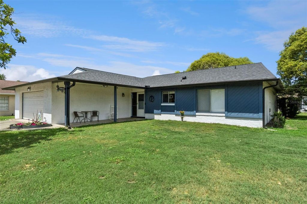 Photo of 10044 Garrison Lane, Orlando, FL 32821 (MLS # O6408307)