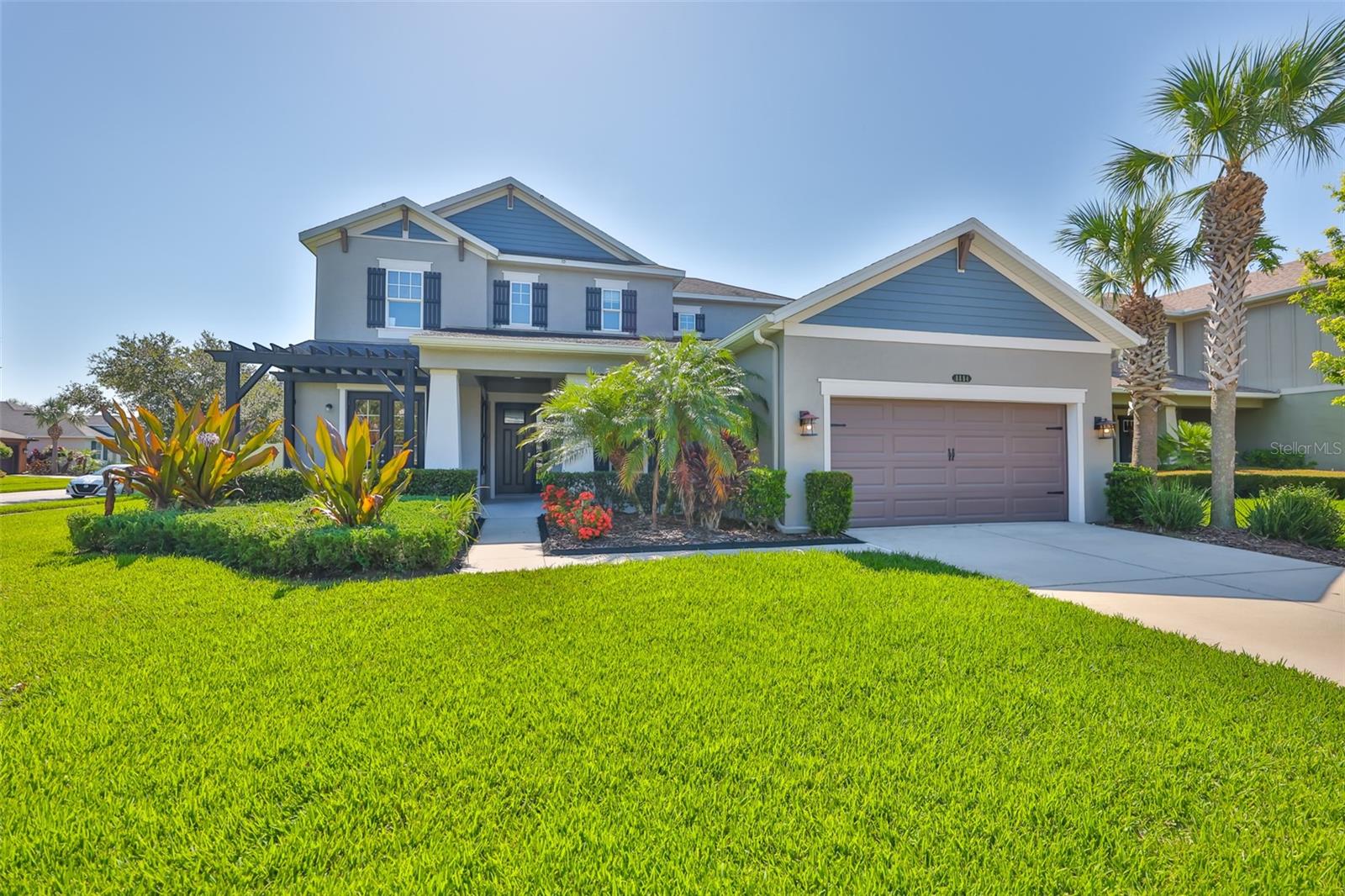 Welcome to 8884 Bella Vita Cir., a stunning haven nestled in the heart of Land O' Lakes Gardenia Glen section of Connerton. This wonderfully crafted Taylor Morrison home offers the perfect blend of quality built, comfort and friendly charm. Step inside to soaring ceilings, sunlit open living spaces, and a gourmet kitchen designed for gathering and memory-making. This thoughtfully designed layout offers spacious bedrooms including first floor owner's suite and an additional full bedroom suite on this level, as well as 3 spacious, separate bedrooms upstairs with baths. There are also versatile flex areas perfect for work, play, or relaxation. Outside, enjoy an enclosed/ fenced in backyard great for entertaining large gatherings and also an expansive, serene space for playtime! Out front, off second bedroom suite, a front private patio attached offers for an intimate glass of bubble to be shared! Fully landscaped property and in a gated community sure to please any discriminating buyer, Gardenia Glen is a fabulous subdivision located in a warm, welcoming community with top-rated schools, nearby parks and recreation, and everyday conveniences just minutes away--this is where your next chapter begins. 8884 Bella Vita isn't just a house, it's the home where your family's story unfolds!