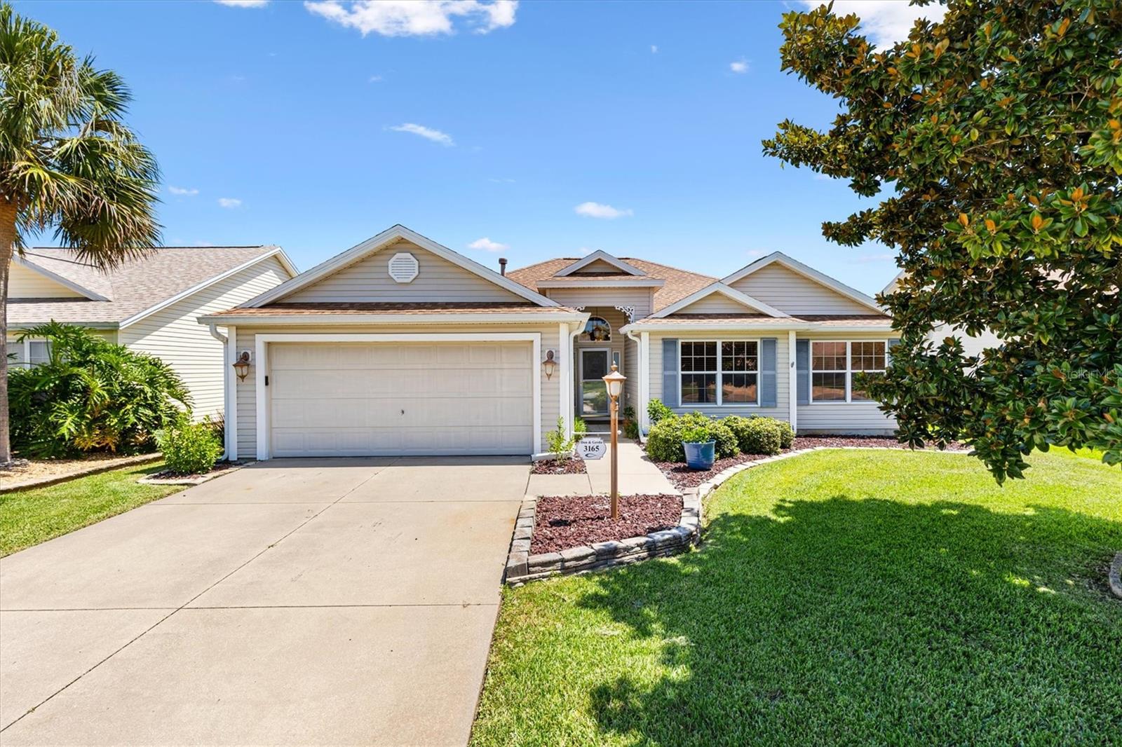 ROOF 2021 HWH 2022 BOND PAID! 4 miles to Sumter Landing!! Beautiful 3/2 Hawthorne model nestled on a quiet cul-de-sac in the Village of Polo Ridge! Covered front porch opens to a bright entry featuring glass panels, a transom window, and storm door. Inside you are welcomed by a spacious foyer complete with a convenient coat closet. The expansive living room with soaring vaulted ceilings and a wall of windows for natural light includes a remote-controlled ceiling fan with light kit. The home features luxury vinyl plank floors throughout the main living areas, tile in the baths, and vinyl in the kitchen for easy care. The layout includes a separate formal dining room, a bright eat-in kitchen for casual dining with stainless steel appliances, gas stove, center island, pull-out cabinet shelves, and a pass-thru to the dining room. French doors from both the kitchen and dining area open to the wrap-around enclosed lanai, complete with pull-down shades, creating a perfect space for relaxing or entertaining. The master suite is a true retreat with double French doors, a spacious walk-in closet, and an ensuite bath featuring a dual vanities and a step-in shower with built-in bench (no tub). The split floor plan provides privacy for guests, with two additional bedrooms and a guest bath with jetted tub. The third bedroom has no closet, making it versatile in nature and can easily serve as an office, den, or craft room, catering to your lifestyle needs. Additional highlights include: ceiling fans throughout, gutters around the home, gas dryer, a termite bond with Massey for peace of mind, and a charming paver patio in the back, perfect for grilling and outdoor gatherings. Don’t miss this opportunity to enjoy low-maintenance living and convenience in a friendly neighborhood. The Polo Club and Fields, Saddlebrook Recreation Center, Laurel Manor Recreation Center and Pool and Hawks Bay Executive Golf Course are all less than 1 mile away. This location is just minutes to shopping, dining, doctors and all the activities the Villages provides. Watch our video and make your appointment to see this house today so you can start living The Villages Dream!
