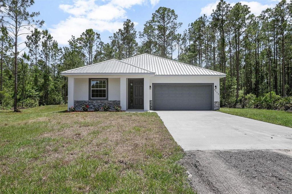 Photo of 5542 Buckeye Lane, Bunnell, FL 32110 (MLS # O6353909)