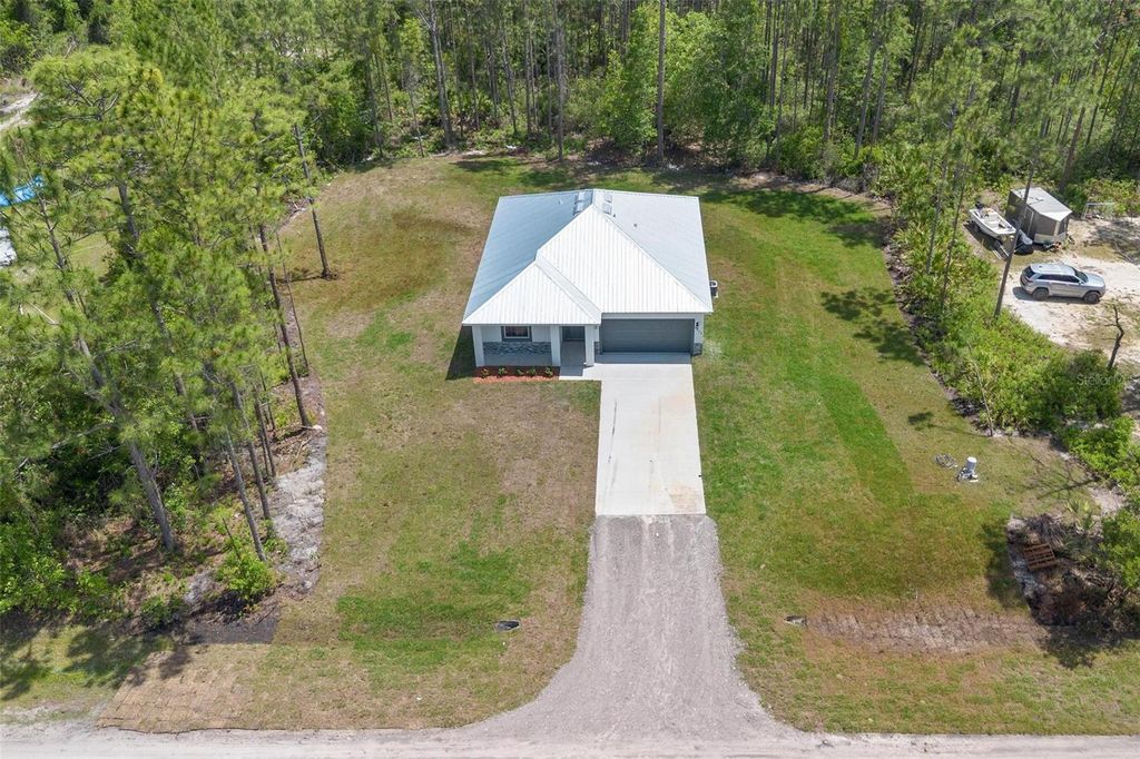 Photo of 5542 Buckeye Lane, Bunnell, FL 32110 (MLS # O6353909)