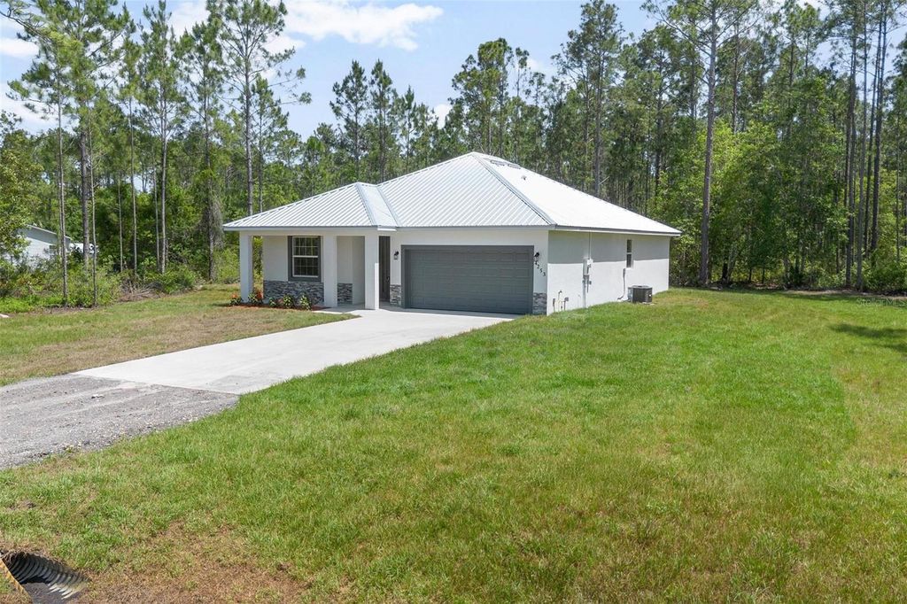 Photo of 5542 Buckeye Lane, Bunnell, FL 32110 (MLS # O6353909)