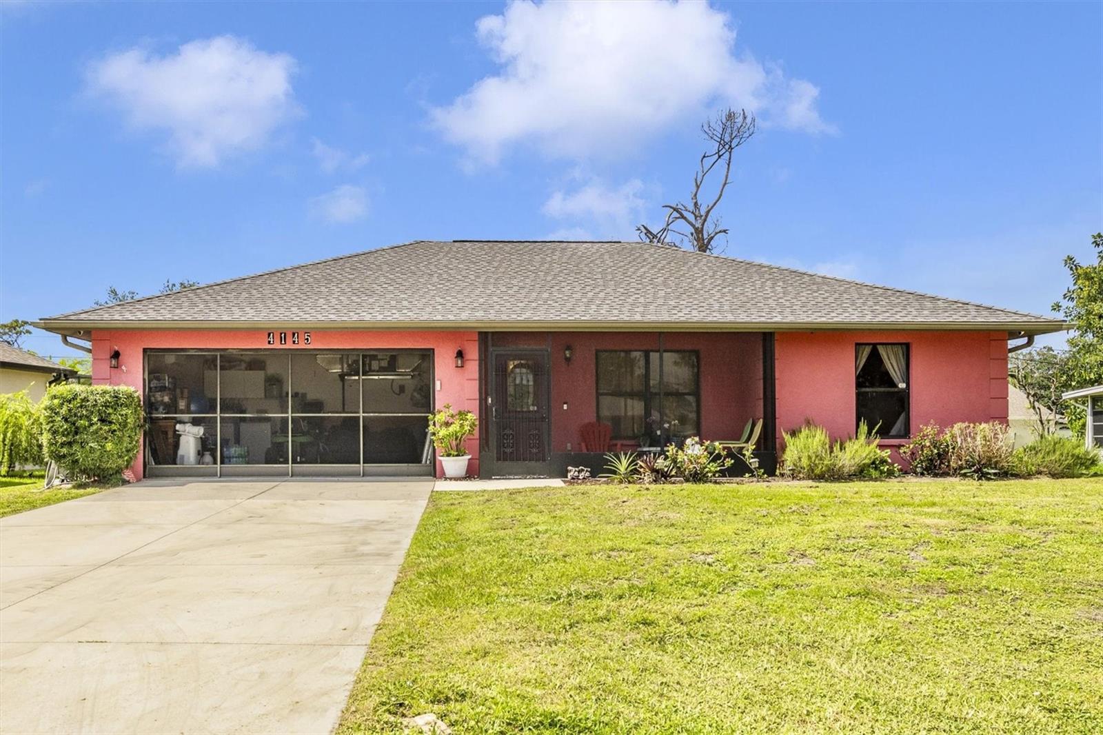 Situated on nearly ¼ acre of land and high and dry in a non-flood zone, this 3 bedroom, 2 bathroom, 2-car garage home is a must-see. Enjoy the benefits of public water and a new roof installed in 2023. Step inside to find new laminate flooring throughout and a fully updated kitchen complete with brand-new cabinets and appliances. The split floor plan provides privacy, while the garage is equipped with a mini-split AC, offering comfort and versatility. Outdoor living is easy with a screened-in front porch, a lanai out back, and a spacious backyard adorned with mature fruit trees. A new septic system was installed in 2018, providing peace of mind for years to come. Zoned for "A" Rated schools, you are centrally located between I-75 and US-41 making commuting a breeze. You’re just minutes from Cocoplum Village Shops, restaurants, and popular attractions like the North Port Aquatic Center, Wellen Park, golf courses, and gulf beaches. Don’t miss the opportunity to make this move-in-ready gem your new home—schedule your showing today.