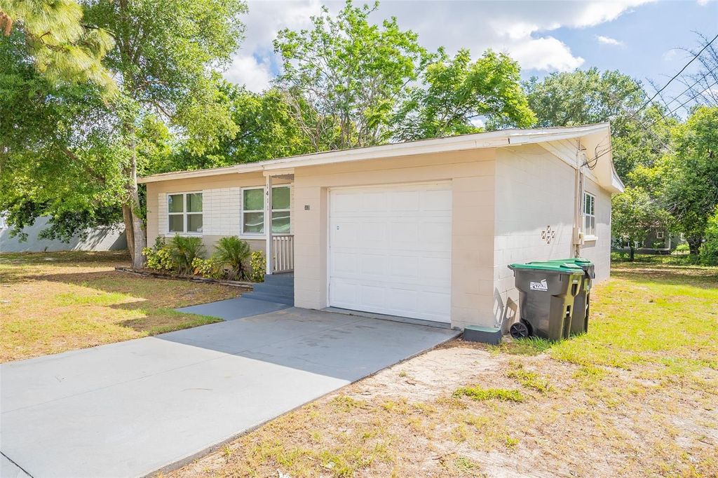 Photo of 1411 N Powers Drive, Orlando, FL 32818 (MLS # O6354503)