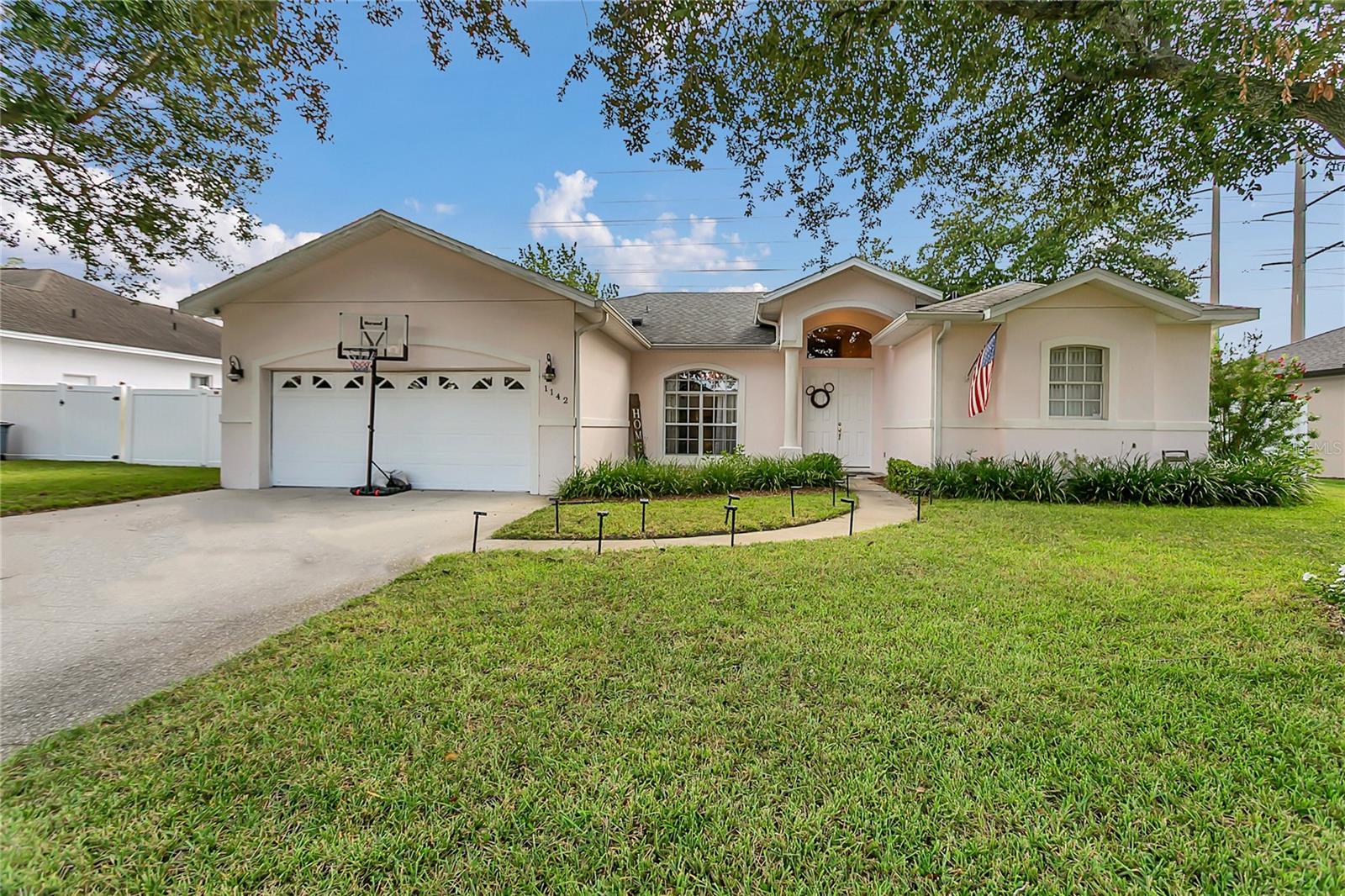 If you're craving peace and privacy without sacrificing location, 1142 Kerwood Circle might just be the one. This thoughtfully updated 3-bedroom, 2-bath home sits on the quiet west side of Oviedo in the highly desirable Tuska Ridge community—where mature trees, nearby nature trails, and A-rated schools come standard. Inside, the open layout and split-bedroom design are tailor-made for modern living—ideal for remote work, entertaining, or just enjoying daily comfort. The remodeled primary bath features upgraded lighting and a modern tub with a blu-tooth speaker / ventilation system and mood lighting all-in-one! he kitchen has been refreshed with a new sink and disposal unit. Flexible living spaces allow for personalized use—including a dining room that doubles as a sitting area beneath a chandelier. The built-in entertainment center has been smartly reimagined for family photos or display. Step outside to a fully fenced backyard that blends privacy with purpose. You'll find a tile-screened porch, mature avocado and plumeria trees, and even a garden area with full sun. Stepping stones and thoughtful landscaping makie this home as practical as it is inviting. The garage features a new Wi-Fi belt-drive door system with newly installed springs, easy attic access from the pulldown stairs provides added storage. Washer and dryer do not convey. With the 417 just minutes away, you'll have quick access to downtown Orlando, UCF, and the theme parks—without a lot of congestion. Walk to the nearby Target. Local parks, green spaces, and Oviedo’s shops and restaurants are right around the corner. Homes in Tuska Ridge at this price point don’t come around often—and when they do, they don’t stay available for long. Don’t miss your chance to make this one yours. Roof = 2019, Bathrooms = 2022, AC = 2022