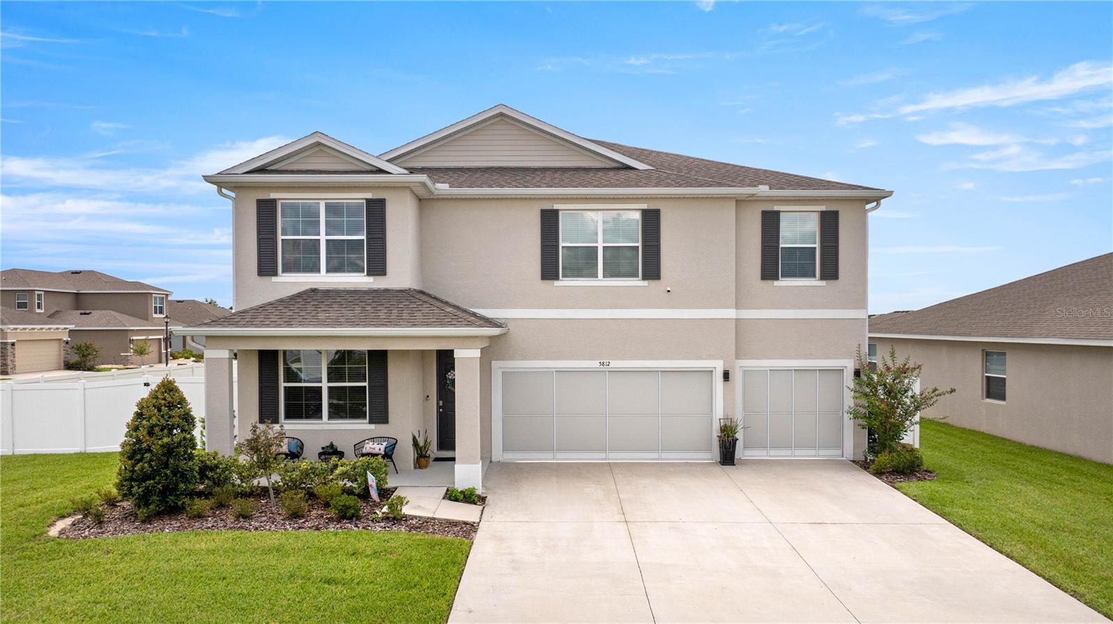Better than new construction with NO CDD, low HOA and all the extras already complete and ready to enjoy! From the moment you step inside, you’ll be captivated by the elegance and comfort that define this impressive 5-bedroom/4.5-bath retreat. Notice the uniquely designed feature wall and modern wood finishes taking the space from basic to grand! Enjoy the peace and privacy of this oversized, corner lot, with fenced backyard, and dual extended, covered lanai's perfect for entertaining or winding down after a busy day - appreciating Florida’s beautiful weather. The professional kitchen, with tons of natural light, seamlessly flows into a spacious family room—perfect for both entertaining and intimate gatherings. With its expansive center island, ample cabinetry, and granite countertops, this chef-inspired kitchen delivers both beauty and functionality, complete with a generous walk-in pantry. The unique Torino floorplan is thoughtfully appointed, with a sitting room or office up front, an oversized formal dining room, and a flexible first-floor ensuite that invites endless possibilities. All hard flooring on the first floor expands your options, whether you envision a stylish playroom, formal living area or multi-generational suite. Additional storage tucked alongside the staircase and overhead in the garage ensures a clutter-free home. Walk up the stairs to the second level to discover four well-appointed bedrooms and 3 pristine bathrooms—two of which are ensuite—plus a sprawling loft/game room perfect for elevated entertaining. A second-floor laundry room, ceiling fans, finished garage floor, whole-house water filtration, front and backyard irrigation, gutters, and smart home features enhance modern conveniences, including keyless door locks, smart garage opener, smart switches, and video doorbell. Experience luxury living and unmatched style in the Brookhaven community, all while placing you just moments from Ocala’s best schools, dining, shopping, and medical facilities. Don't miss out, call for your private showing today!