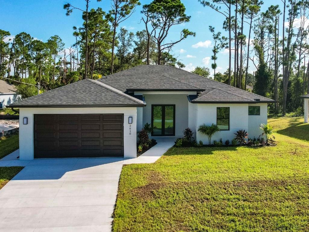 MOVE-IN READY NEW CONSTRUCTION! This 3-bedroom + flex room/office, 2-bathroom home combines functionality, beauty, and peace of mind in a growing area of North Port that offers both tranquility and quick access to everything you need. Built in 2025, this open-concept residence features 9'4" ceilings, gorgeous 24"x48" tile floors throughout, HURRICANE IMPACT windows, and a tiled lanai perfect for entertaining. The modern kitchen boasts stainless steel appliances, quartz countertops, a LARGE center island and ample cabinet space. NO HOA, NO CDD, and NO FLOOD INSURANCE required. Minutes from I-75 and US-41 for commuters, Cocoplum Plaza (Publix, Aldi, Starbucks, HomeGoods, dining, Wellen Park and CoolToday Park (Braves spring training), North Port Aquatic Center, New Sarasota Memorial Hospital. Beaches: Venice, Manasota Key, and Englewood all under 35 mins—this home is ideal as a primary residence, vacation retreat, or investment property.