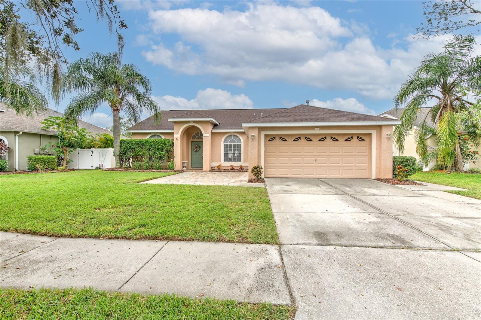 Wonderful opportunity to own this beautiful saltwater heated pool home! Situated in the desirable Hickory Lake Estates, this 3 bedroom / 2 bathroom pool is truly move in ready with the major items, HVAC (2023) and roof (2021), already taken care of for you. As you enter the home you will be greeted by the abundance of natural light and open floor plan, with a combined living and dining area perfect for entertaining. Luxurious hardwood floor and oversized baseboards run throughout the main living space. The kitchen is a true show stopper providing a chef with everything they desire, boasting wood cabinets, stone counters, stainless appliances, a gas range, endless storage and much more. The home is a split floor plan, offering a perfect combination of privacy and functionality. The primary suite is on one end of the home with a walk in closet and en-suite bath, while two generously sized rooms are situated on the other side of the home. The updated back den provides a bonus space, and also the opportunity to easily work form home given the built-in cabinets and desk space. As you enter the backyard, you will love the outdoor oasis that sets the stage for true Florida living. The heated saltwater pool and jacuzzi accompany an expansive paver deck, with plenty of room to relax and entertain. On top of that, the large fenced in yard also offers ample green space to allow the family and pets to roam freely with peace of mind. Close proximity to everything the area has to offer, with limitless options for shopping, dining and entertainment moments away and the home is conveniently located near SR-60, I-75, I-4 and the Crosstown, allowing for an easy commute to downtown Tampa, Tampa International Airport and more. With so many features, this home truly does provide the perfect blend of comfort and convenience.