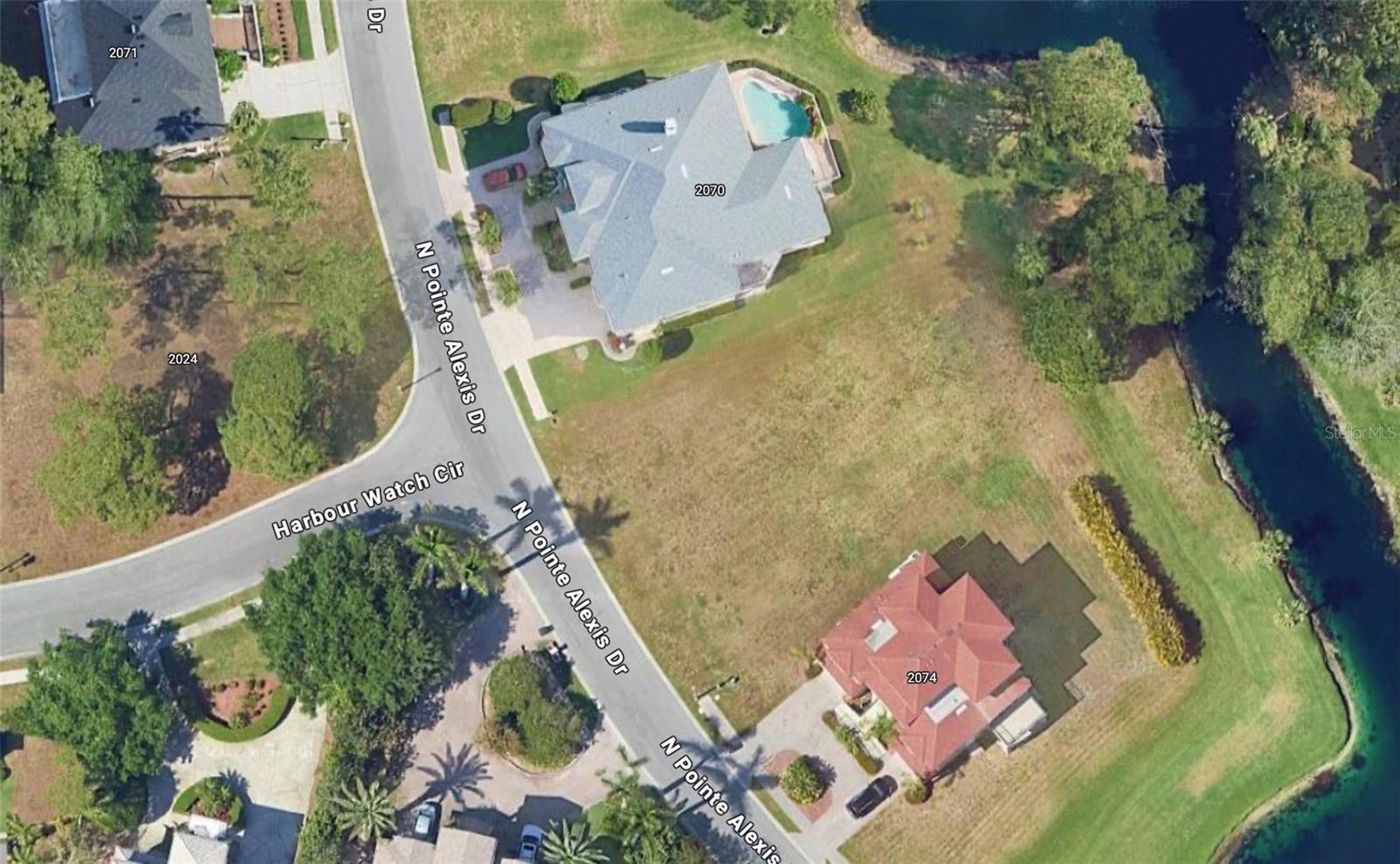 Don't miss the chance to own one of the last remaining water-view lots in the prestigious gated community of Harbour Watch at Pointe Alexis North. This is your opportunity to build the home of your dreams and enjoy the exceptional amenities this community has to offer.
Harbour Watch, a picturesque peninsula nestled between the Gulf of Mexico and the Anclote River, features a stunning 15-acre interior lake. The community offers upscale amenities, including a private clubhouse, expansive sundeck, pool and spa, tennis courts, playground, and a community pier with a charming gazebo.
Surrounded by natural beauty and tranquility, Harbour Watch provides a unique setting with breathtaking water views and easy access to outstanding dining, shopping, and entertainment options. The community is also conveniently located near Anclote River Park, which features beach access and a boat launch, as well as the world-renowned Tarpon Springs Sponge Docks.
Visit today and experience the serenity and beauty of Harbour Watch for yourself!