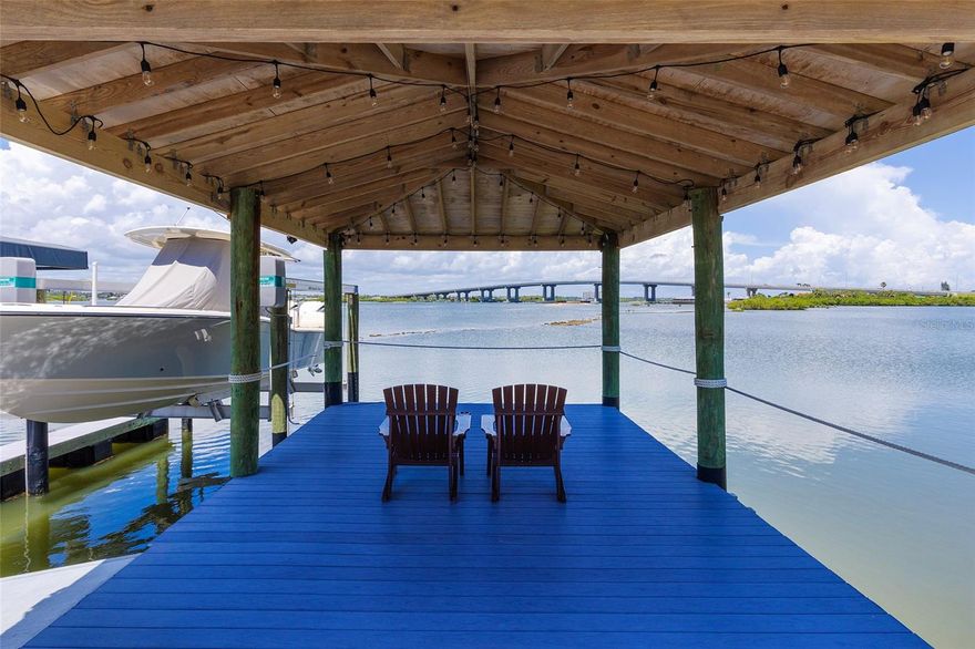 Build the beachside home with boat dock access that you have been dreaming of! Perfectly situated along the banks of the Halifax River, this oversized lot in the gated community, Anglers Cove, is ready for your inspiration. Build a custom 3-story residence with beach and intracoastal views from sunrise to sunset, and enjoy a convenient location that is just minutes to the mainland by car, and a short and relaxing boat ride to inlet access. Property includes a boat slip with a 15x35 Shore Station covered canopy that retracts incase of storms and a 13,000 lb. high speed lift. Inquire for survey and architectural plans for a home that includes an RV garage, a water view balcony, and 6,000+ square feet! Daily boating, fishing, and easy walks to the beach are waiting - don't miss out!