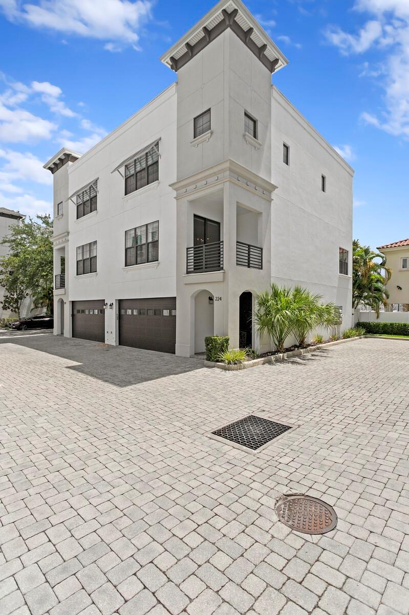One or more photo(s) has been virtually staged. This meticulously maintained 3-story townhouse offers 4 bedrooms, 3.5 bathrooms, and a thoughtfully designed split floor plan ideal for flexible living. The first floor includes two bedrooms—perfect for guests, a home office, or an in-law suite—while the top floor offers two additional bedrooms for enhanced privacy. The generous primary suite boasts a luxurious en-suite bathroom featuring dual walk-in closets, a spa-like walk-in shower, and soaking tub. A versatile bonus space within the suite can be used as a nursery, home office, or additional closet. On the second floor, enjoy a beautifully appointed chef’s kitchen with a wine fridge, white cabinetry with soft-close drawers, and hardwood flooring throughout. The open-concept layout includes a dining area, spacious living room, and balcony—perfect for morning coffee or evening relaxation. Additional features include, first-floor wet bar (ideal as a coffee station), hardwood floors throughout most of the home, private fenced patio with space for outdoor seating and a BBQ. Located in the highly sought-after Plant High School District and just blocks from a top-rated elementary school, this home offers unbeatable convenience and lifestyle. Enjoy close proximity to SoHo, Bayshore Boulevard, Hyde Park, Channelside, and MacDill Air Force Base. Application fee is $75 per adult, once approved a $75 lease administration fee applies.