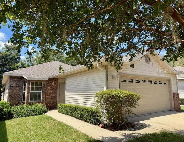 Unleash the potential of this 2-bed, 2-bath diamond in the rough located in a fantastic NW Gainesville pool community! Whether you're a seasoned investor or a homeowner ready for a rewarding DIY project, this is your chance to transform a great house into an incredible home. Located at The Gardens in the Blues Creek neighborhood, the 1,207 sq ft home features wood laminate flooring, an open floor plan, and a screened porch with serene views of the common area. With a seamless flow, the entryway leads to a light and bright kitchen, complete with a full set of appliances, including a new garbage disposal. The kitchen overlooks the dining and living areas, making it a dream for easily hosting friends and family. Off the living room, garden doors open to a screened porch, perfect for relaxing with a good book or beverage while watching the sun set. The primary suite is highlighted by a classic bay window with a cozy window seat, a large walk-in closet with shelving, and an ensuite with double sinks and tub/shower combo. At the other end of the hall is a guest room, a full guest bath, and a laundry closet equipped with a washer and dryer. Enjoy a truly low-maintenance lifestyle where the HOA fees cover all lawn care and exterior maintenance, including the roof. The community features a great array of amenities, including a pool, tennis courts, a clubhouse for hosting events, and direct access to scenic nature trails for hiking and biking. You'll also appreciate the convenience of underground utilities and sidewalks. All of this is just minutes away from local shops and restaurants, and a quick 20-minute commute to UF, Santa Fe College, and Shands. This home is priced to sell and ready for your personal touch, so act fast, as homes in this area are in high demand!