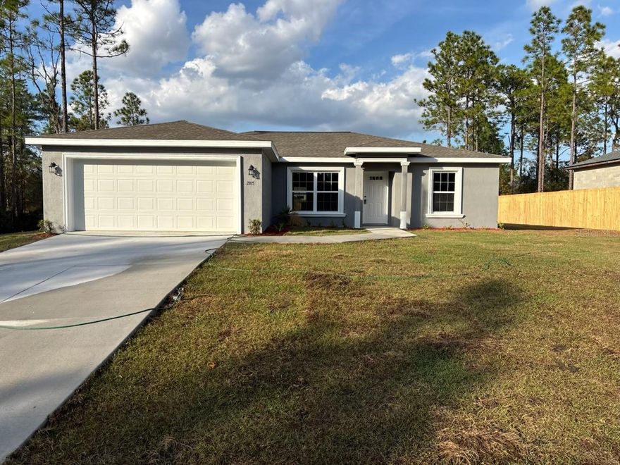 NEW CONSTRUCTION. MOVE-IN READY! This Key West Model offers 3 bedrooms and 2 bathrooms, totaling 1,405 square feet of comfortable living space. The home is built with concrete block construction, a 30-year architectural shingle roof, and energy-efficient double-pane windows for long-lasting quality. The living room features a vaulted ceiling, and the kitchen includes stainless steel appliances, custom white shaker cabinets with soft-close drawers, granite countertops, and a kitchen pantry for easy storage. Luxury vinyl plank flooring runs throughout the home, and the master suite is the largest the builder offers, featuring a glass-enclosed shower and a simple, clean design. The main bathroom features a practical tub-and-shower combo. The laundry room offers a functional layout, and the covered patio opens to a backyard with a privacy fence along the right and back sides of the property. An attached 2-car garage with an opener and remotes adds convenience. The home sits in flood zone X, which is high and dry and does not require flood insurance, and the property has no HOA fees for added freedom. A 10-year structural warranty offers peace of mind.
