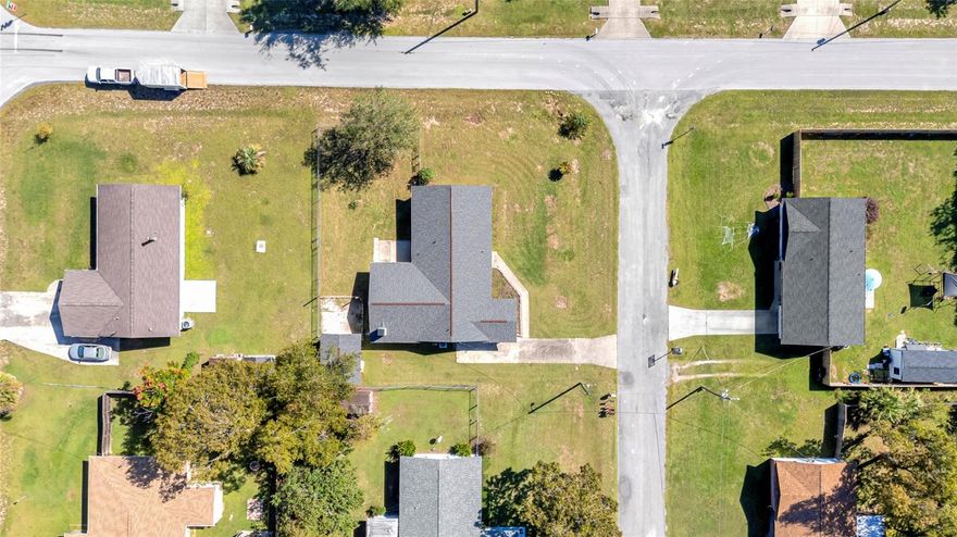 BRAND NEW ROOF! Welcome to This Beautiful 4-Bedroom, 2-Bathroom Home on a Corner Lot with Fantastic Outdoor Space! Located in the Florida Heights/Silver Spring Shores neighborhood, this spacious home offers room to spread out both inside and out. Step into a bright and inviting living room, complemented by a separate family room featuring a cozy brick fireplace – perfect for relaxed evenings or casual entertaining. The large kitchen is a chef’s dream, complete with a center island, built-in wine rack, ample cabinet space, and an enclosed pantry. There’s plenty of room to prep, cook, and gather with loved ones. Adjacent to the kitchen is a dedicated inside laundry room for added convenience, large enough for extra storage or folding laundry. The primary bedroom serves as a quiet retreat and easy access to a private, efficient en suite bathroom with a walk-in shower. Three additional bedrooms provide flexibility for guests, home office, or hobbies. Step outside to enjoy Florida living in the fenced backyard, ideal for pets, play, and privacy. A sandy fire pit area sets the scene for cozy nights under the stars or a great play place for the kiddos. The patio is ready for grilling or gatherings, plenty of room all. A storage shed offers 50 AMP electric service and adds practical outdoor storage, and the corner lot gives you just a little more breathing room.  This well-maintained property offers comfort, charm, and functionality and NO HOA all in one, HVAC replaced in 2018, Water Heater Replaced in 2018– come see what makes it feel like home!