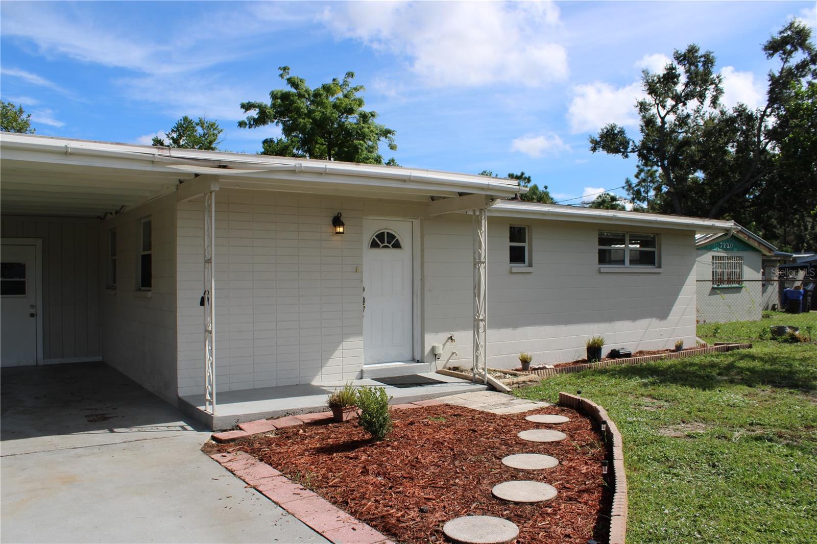 Want an immediate rental or a starter home? THIS could be your JACKPOT! Located oh so close to Tampa's Hard Rock, the Florida State Fairgrounds, The Florida Aquarium, TGH, MacDill AFB, this location is a WIN! Recent renovations include luxury vinyl in common areas, updated kitchen with stainless appliances and tile backsplash, updated bathroom. The fully fenced yard is ideal for securing pets, while the open space allows for gardening or simply enjoying the outdoors from your covered back porch. Large storage shed is roomy enough for all those gardening supplies! Indoor utility is conveniently located off the kitchen. Outdoor storage in the carport provides extra storage space for tools. Other features include: updated windows, Roof 2017, HVAC 2017, Water Heater 2019. Schedule a tour today!