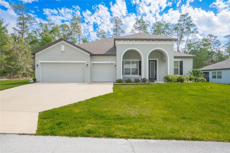 Like NEW and without the wait in the highly sought-after Sugarmill Woods Oak Village! Built in 2022 and offering 3,060 living, this beautifully designed home blends modern comfort with spacious living on a .28-acre lot. Step inside to an inviting open floor plan with a split bedroom layout, perfect for both everyday living and entertaining. The expansive living area flows seamlessly into the kitchen featuring solid surface countertops, soft close wood cabinetry, pantry, breakfast bar, and breakfast nook. A separate dining room and dedicated office provide flexibility for work and gatherings. The primary suite offers a private retreat with dual sinks, walk-in closet(s), and a walk-in shower, while three additional bedrooms provide ample space for family or guests and walk-in closets. Home features include 9'doors, 5" baseboards, recess lighting, a expansive 11x 8.9 interior laundry, volume ceilings, tray ceilings, blinds, and abundant natural light throughout. Enjoy the convenience of a 3-car attached garage, tesla charger, concrete driveway, covered lanai, and ground-level entry. If you’ve been searching for space, style, and newer construction in Sugarmill Woods—this one checks all the boxes. Bonus: Conveniently located about 1 mile from the Suncoast Parkway and a stones throw from the Chassahowitzka trail for outdoor enthusiast! Schedule your private showing today...Optional Golf memberships are also available.
