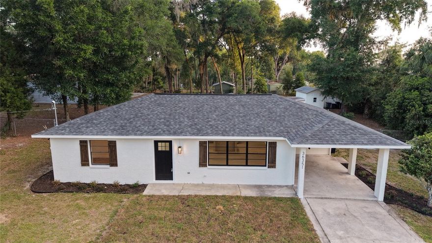 Experience the perfect blend of country freedom and modern convenience in this 3BR/2BA home on 1.24 sprawling acres in fast-growing Dade City! With NO HOA or CDD fees, this property is a rare find featuring a dedicated RV pad with an independent electric panel and drainage system, a large metal storage shed, and two additional workshops. Enjoy the peace of rural living while being just 5 minutes from Publix and minutes from the interstate. Whether you're looking for space for your toys or a quiet retreat, this move-in-ready home offers the infrastructure and location you’ve been searching for.