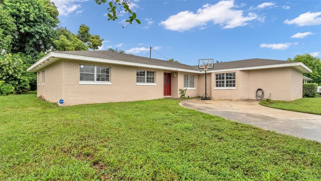 Photo of 409 Lake Ned Road, Winter Haven, FL 33884 (MLS # P4936594)