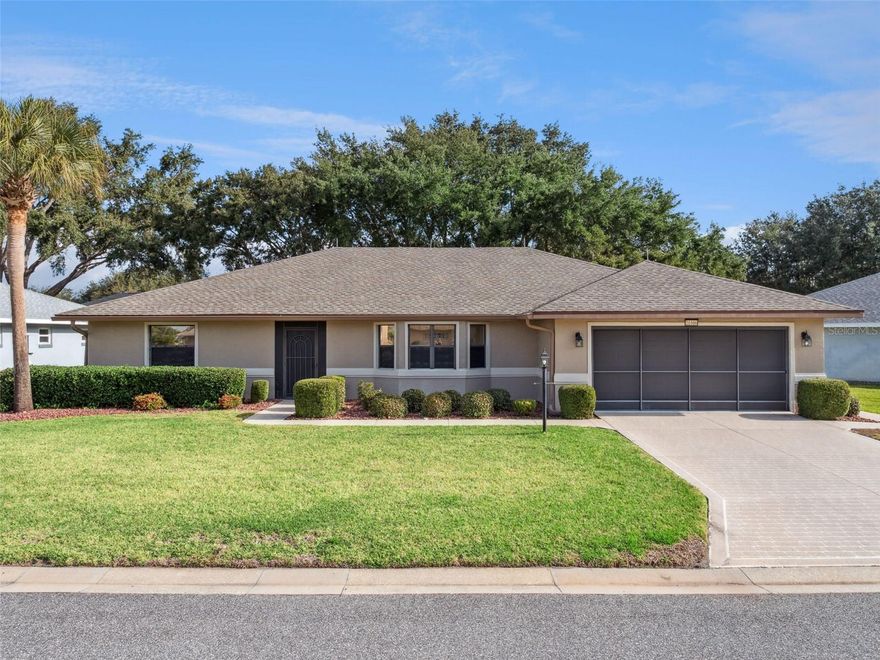 One or more photo(s) has been virtually staged. Welcome to this move-in ready three-bedroom, two-bathroom block and stucco home located in the highly sought-after 55+ gated golf community of Royal Highlands. Nestled on a quiet court, this residence features fresh interior and exterior paint, a water softener, central vacuum system, and a transferable termite bond for your peace of mind.  The Majestic Model split bedroom floor plan offers a screened entry, a spacious Florida Room, and a versatile bonus area, providing both casual and formal living spaces to suit your lifestyle. The home is immaculately maintained—clean as a whistle! The kitchen boasts Corian countertops, refaced cabinets, a gas range, a full stainless steel appliance package, a pantry, garbage disposal, and easy-care laminate floors.  Both bathrooms are updated with granite counters. The primary bathroom features a relaxing soaker tub, ample customized closets, and a step-in shower. Additional highlights include luxury vinyl plank (LVP) flooring, a new gas clothes dryer, an open patio in the backyard, 3M window tinting, lightning rods on the roof, pull-down attic stairs, and a utility sink in the garage. Enjoy the peace of mind of a brand-new 2024 roof! There is lovely green space between homes, and you’ll appreciate the close proximity to community amenities and a short drive to SR27. Lake County boasts over 1,500 named lakes, and Royal Highlands is conveniently located near the Florida Turnpike, I-75, Orlando International Airport (MCO), amusement parks, historic districts, shopping, and medical facilities.  Royal Highlands offers an impressive array of amenities, including an 18-hole golf course with a full-service restaurant, a driving range, two pools, courts, a softball field, arts and crafts rooms, a fitness center, a library, Great Hall with theater stage & dance floor, and you’ll find a billiards room at the Recreation Center. Call today to schedule your private tour and experience all this vibrant community has to offer!