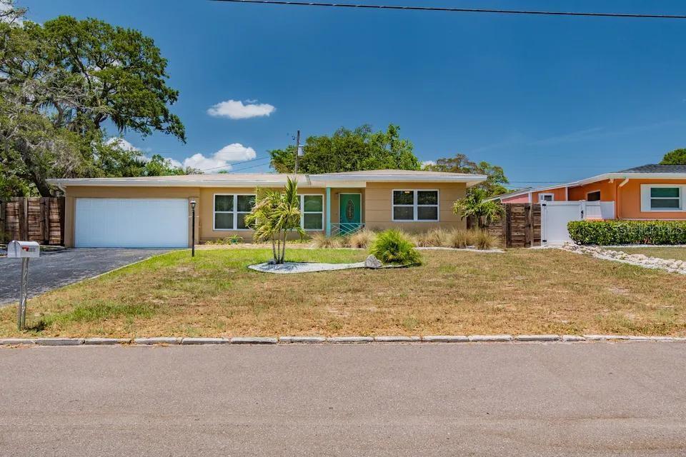 Welcome to your perfect beachside retreat! This beautifully renovated 2-bedroom, 2-bath home combines timeless charm with modern updates. From the moment you step through the front door, the open and inviting layout makes you feel right at home.
Restored terazzo floors throughout the home!
The spacious family room that flows effortlessly into the sun-drenched sunroom—ideal for relaxing mornings or entertaining with views of the oversized backyard.
The chef’s kitchen is a true highlight, featuring soft-close gray shaker cabinets, sleek granite countertops, and stainless steel appliances. Double-pane windows provide energy efficiency throughout, and the two-car garage with a separate utility room adds plenty of practical convenience.
Best of all, you’re just minutes—whether by bike or car—from the pristine Gulf beaches. With a backyard that includes drip irrigation along the fence line, keeping your landscape vibrant is effortless.
This is more than a house—it’s the Florida lifestyle you’ve been waiting for.