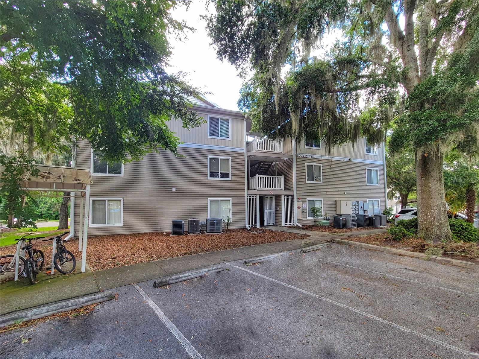 Spacious 4 bed/4 bath first-floor condo located near the University of Florida, UF Health Shands Hospital, and shopping. The unit features tile and laminate wood flooring throughout - NO CARPET! The layout includes a large living area, covered porch with a storage closet, and four bedrooms, each with its own bathroom and walk-in closet. Residents enjoy access to a community pool, fitness center, basketball court, and volleyball court. High-speed internet is included in the HOA, and the location offers easy access to bus routes with service to UF and Shands!