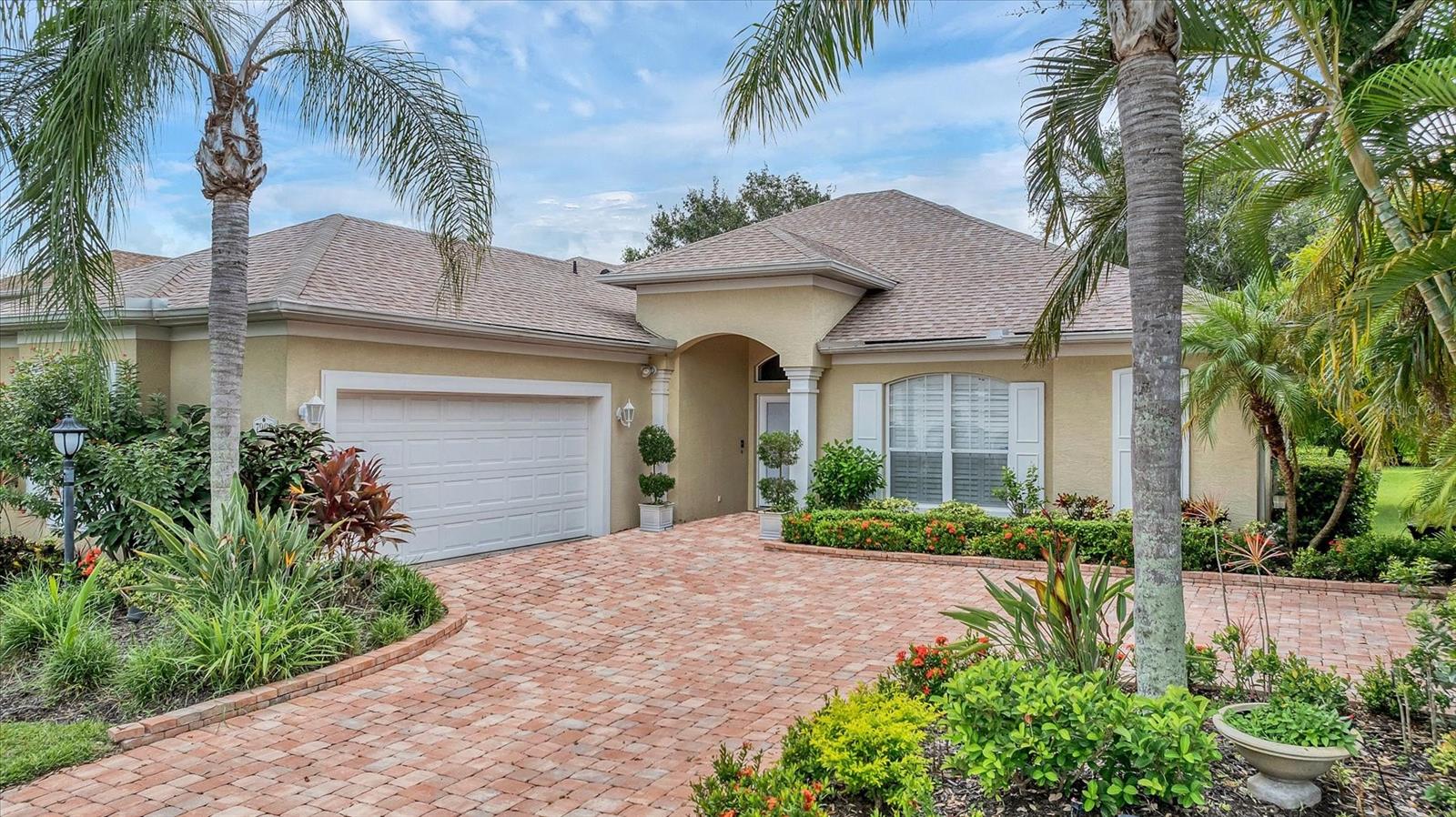 Walk in and prepare to be impressed by this absolutely stunning home! From the moment you step inside, you’ll notice the soaring ceilings and the open-concept design with a thoughtfully planned split-bedroom floor plan—perfectly suited to today’s lifestyle.
The spacious great room offers a seamless flow and opens to a screened lanai with picturesque views of the lush, tropical landscaping, creating the perfect backdrop for relaxing or entertaining. The chef’s kitchen will delight culinary enthusiasts with its generous counter space, abundant cabinetry, and a layout designed to accommodate more than one cook during festive holiday preparations.
The primary suite is a true retreat—expansive in size, featuring a huge walk-in closet and a luxurious spa-style bathroom with dual vanities, a soaking tub, and a separate walk-in shower. Two additional bedrooms are situated for maximum privacy, making them ideal for family, guests, or a home office.
This home has been meticulously maintained—move-in ready, with nothing to do but unpack and enjoy!
Located in a highly desirable gated community, residents enjoy access to a resort-style pool, playground, and beautifully landscaped common areas, all while benefiting from enhanced security and peace of mind.
The location is unbeatable—just minutes from UTC Mall, top-rated grocery stores, fine dining, and endless shopping options. Downtown Sarasota is only 15–20 minutes away, while the #1-rated Siesta Key Beach awaits you in just 30 minutes.
Don’t miss your chance to own this exceptional home. Schedule your private showing today—you’ll be glad you did!