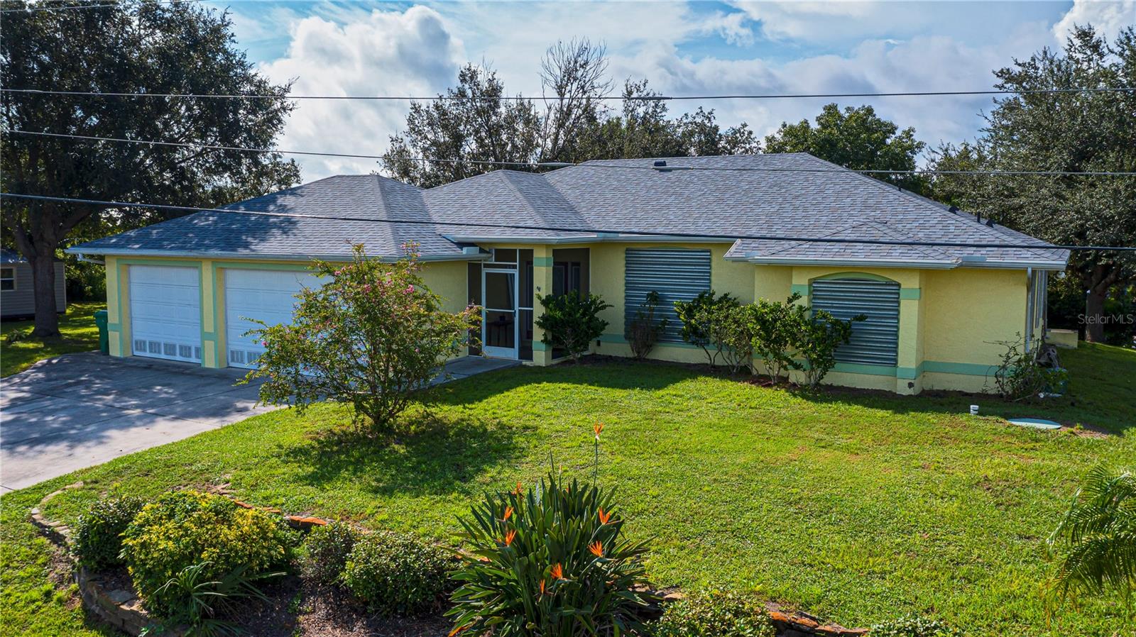 NO BRIDGES OUT!!! This WATERFRONT GEM with 4 GENEROUS LOTS PLUS 162 feet of seawall also has 3 CAR GARAGE in non deed restricted community of Harbor Heights,just a MERE SECONDS TO WIDE OPEN WATER of the PEACE RIVER AND GULF! This 3/2/2 is delightful and spacious, having an extra long driveway for parking and NEW ROOF to thoroughly enjoy. With a welcoming covered and screened front patio , perfect for cross breezes, you are instantly greeted with a trendy etched glass front door accented with etched glass side panels into its natural lit formal foyer once stepping inside. This newer split plan home has a spacious family room and cozy gas fireplace that'll enhance any seasonal chill.Wide galley kitchen boasts corian countertops, convenient breakfast bar, pass thru, stainless appliances including a GAS STOVE, rich maple cabinetry including pantry , nice under lighting and is just perfect for easy entertaining. A separate dining room currently doubling as family room has complimentary concave window adding character and light plus there is a breakfast nook, lots of options with the pocketing slider leading to the extended back screened lanai overlooking the canal. SERENE AND PRIVATE, the large master bedroom also has private patio access through french doors, with beautiful tray ceiling, double walk in closets with ensuite master bath. Jetted tub, private commode, dual sinks, plus lovely oversized tiled shower awaits! Both guest bedrooms share a pretty middle pool bath and have big walk in closets so company will be most comfortable for both long and short stays. Morning or night, enjoy coffee or your favorite adult beverage lounging lavishly overlooking the picturesque canal from the extended L shaped screened patio alone or with all your family and friends. BRING YOUR FISHING POLES AND A BOAT, there is also a dock and of course a 3 CAR GARAGE FOR ALL YOUR TOYS TOO! A 160 foot well is here for irrigation and has a brand new pump this year , hurricane panels for protection and new A/C 2019. EXTRA LONG 162 foot seawall, was stabilized 5 years ago with Eurothane pumped behind it with a 10 year warranty for extra peace of mind. WONDERFUL LOCATION, close to specialty dining, boutique shopping , Pg airport, Sunseeker resort, historic walking downtown of Punta Gorda and hospitals, and NO HOA necessary. Plus the Charlotte Harbor Water Association has recently upgraded the community's water distribution system with new piping at no expense to property owners conveniently located just a mile from the newly renovated 8 ACRE HARBOR HEIGHTS PARK.The park is maintained by Charlotte County and fully accessible to residents and includes a PUBLIC BOAT RAMP, bbq areas, playground, day docks, pavilion, basketball and shuffleboard courts, as well as lighted tennis and pickleball courts, horseshoe pits, and a butterfly garden. The boat ramp offers access to the Peace River, Blueway Trails, Charlotte Harbor, and the Gulf of Mexico! Location, amenities, serenity and a big SALTWATERFRONT home holds the keys to your Florida dream come true...DONT DELAY, make your appointment to see this fantastic home today!