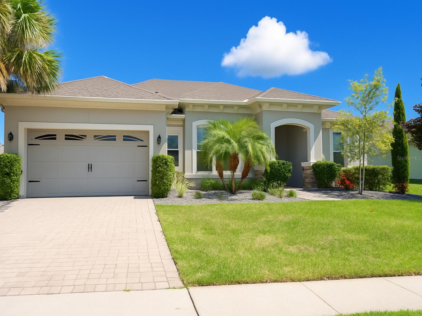 Welcome to this beautiful, upgraded Hibiscus Home model, built in 2017 and located in the highly sought after Cherry Lake Oaks community. This meticulously maintained single-story ranch home features 1,884 square feet, four bedroom, and two full bathrooms, all thoughtfully designed for comfort and style. Step inside to discover an open concept living area with luxury tile flooring, crown molding, and designer paint throughout. The gourmet kitchen is appointed with stainless steel appliances, granite countertops, and upgraded cabinetry seamlessly opening to the family room and dining space. Retreat to the spacious master suite, complete with dual sinks, a separate shower and tub, and California closets. Three additional bedrooms provide ample room for family, guest, or a home office. Enjoy indoor-outdoor living with an extended covered rear lanai overlooking the private yard, perfect for entertaining or quiet evenings. Situated on a premium .29-acre lot with 30' side yard buffers for added privacy, this home offers both space and serenity in a community limited to approximately 70 semi-custom homes. Located just minutes from shopping, dining, and easy access to the Florida Turnpike, this property fits the modern lifestyle. Includes a two-car garage, irrigation system, oversized sliding doors, and pre-wired security system. Low HOA fees. Don't miss your chance to own a thoughtfully upgraded, move-in ready home in a charming, light HOA with low dues. This elegant home is ready for new owners-schedule your private tour today!