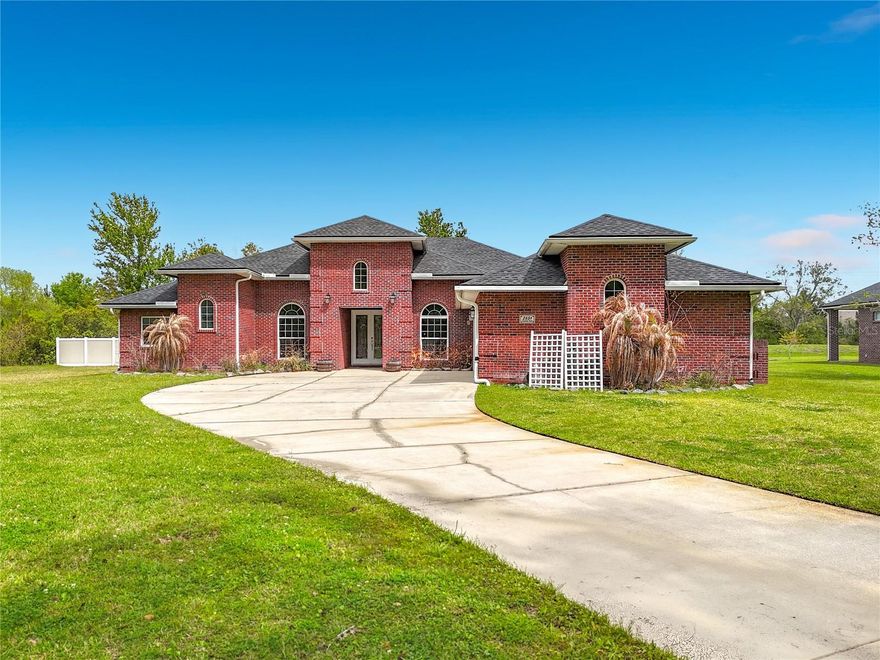 Rare opportunity to own a well maintained 4 bedroom, 3.5 bathroom brick home with a 3 car garage on 2 full acres in Jacksonville, Florida. Situated on its own 1 acre lot, this property also includes the adjacent 1 acre parcel, creating a rare 2 acre setting with added privacy and space. Thoughtfully updated throughout, the home features a remodeled kitchen (2022), new roof (2024), Pella windows, updated HVAC systems, sewer conversion, and hardwood and tile flooring throughout. Outdoor living includes a fully fenced backyard, pool and patio with a screened enclosure rated for winds up to 130 mph and reinforced with a steel super gutter. Additional features include a generator manual transfer system, storm-resistant window door coatings, security system, and drainage improvements. With major updates already completed, this property offers comfort, functionality, and long term value.